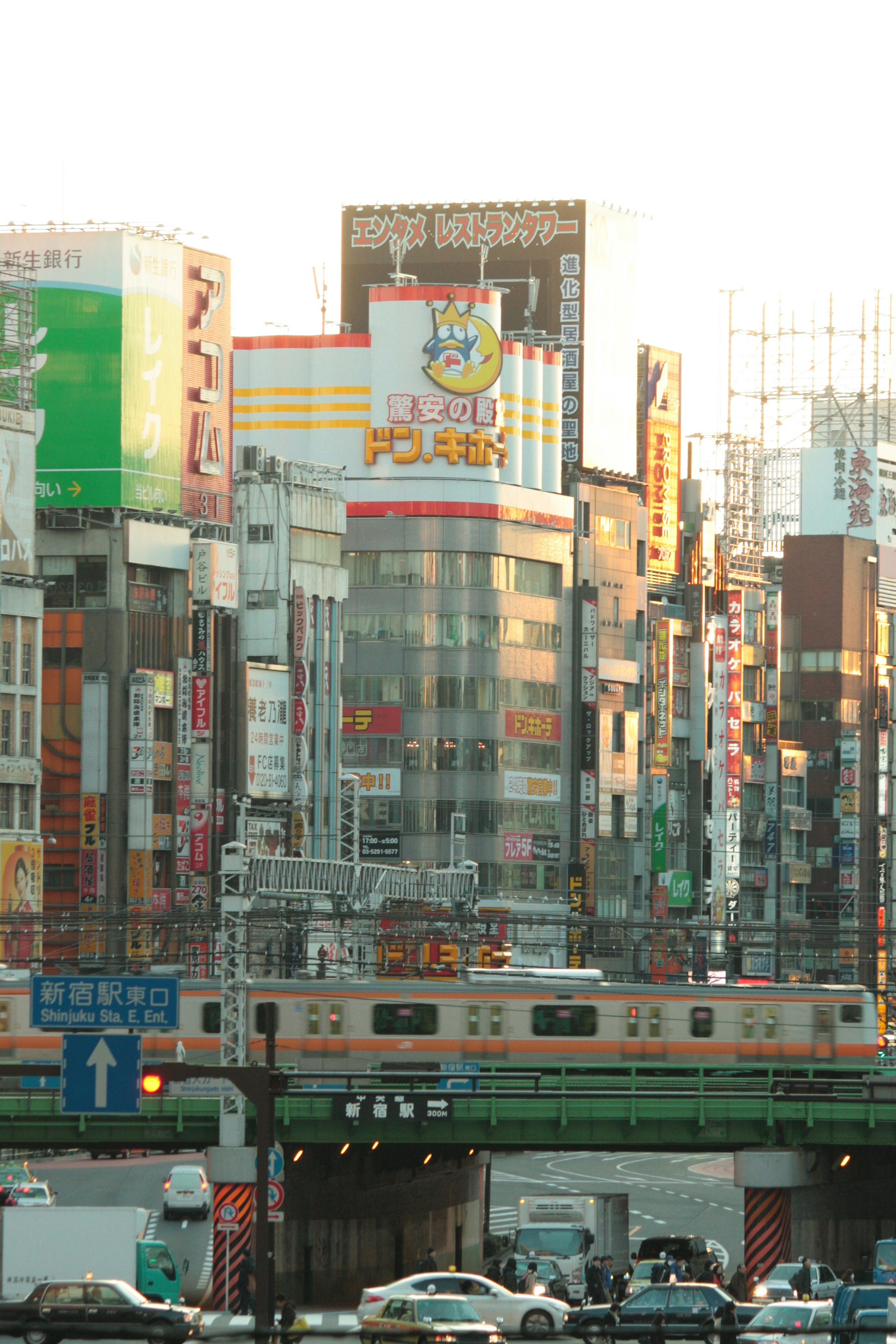 Colorful buildings and train in a bustling urban street