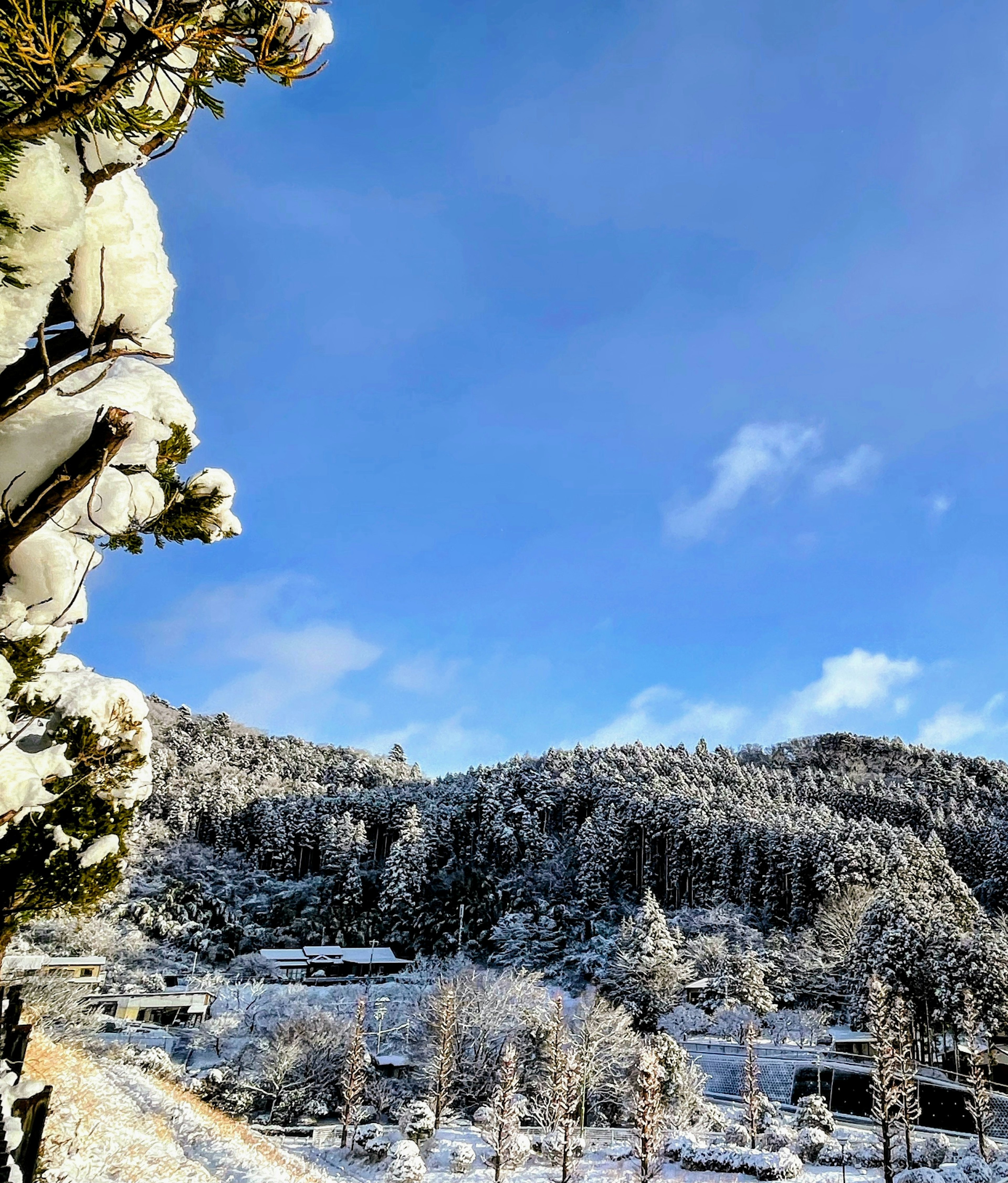 Snow-covered mountains under a blue sky