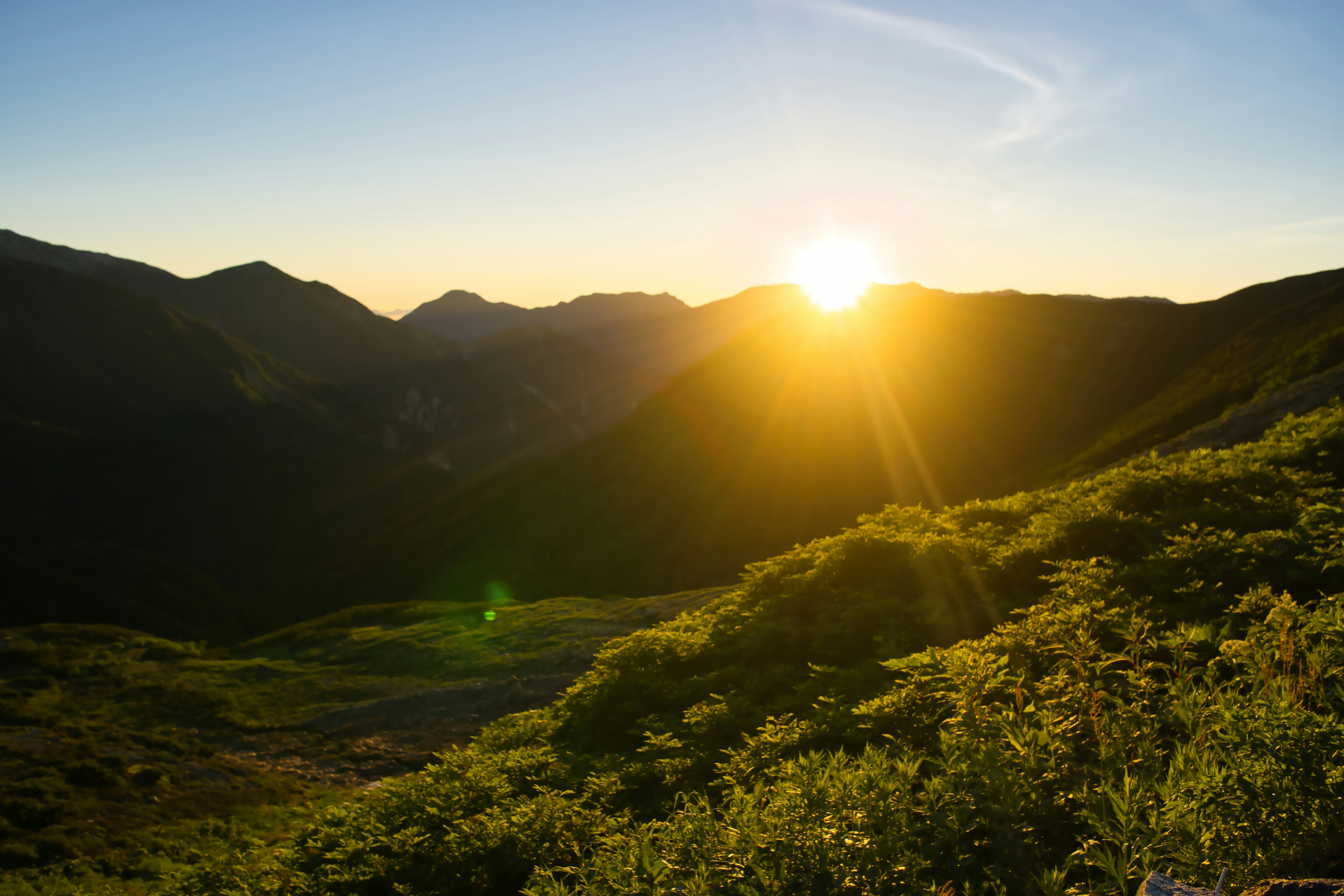 Beautiful mountain landscape with sunrise shining