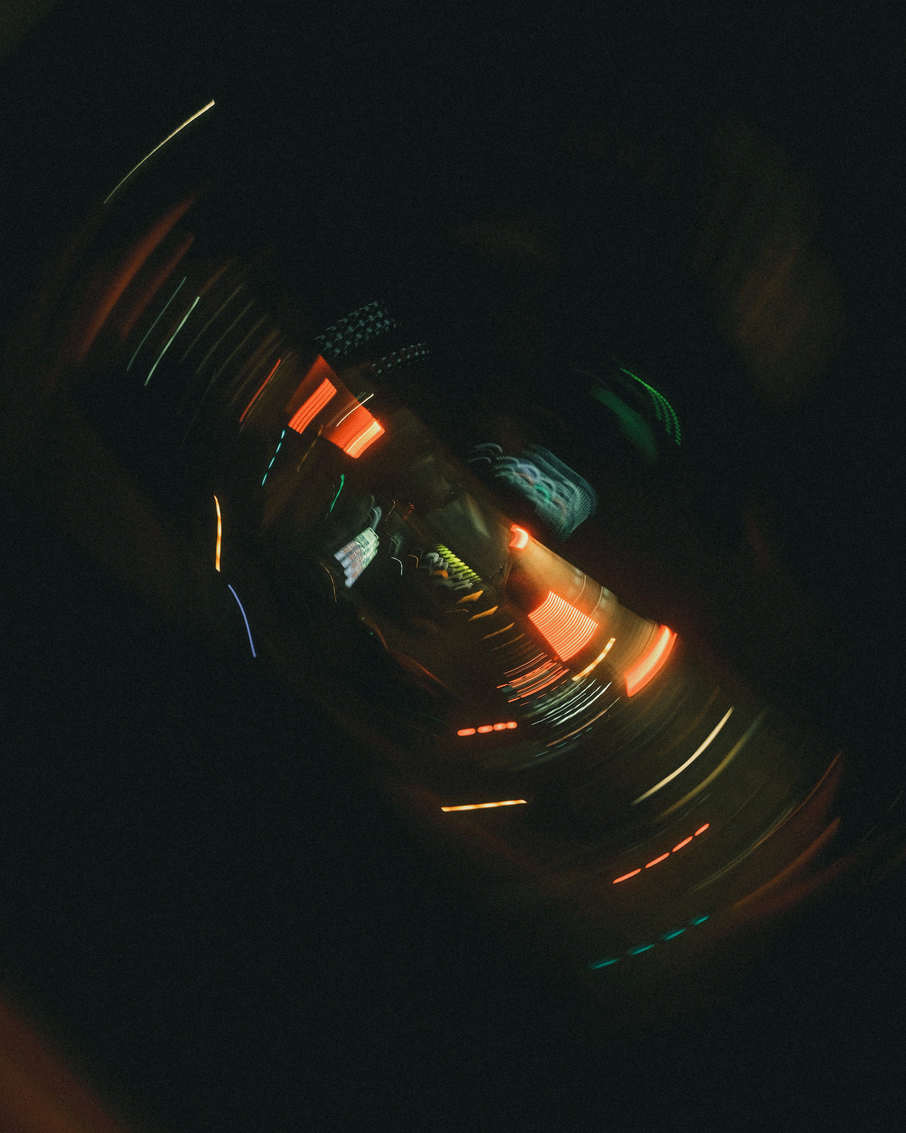 Swirling blur of colorful lights against a dark background