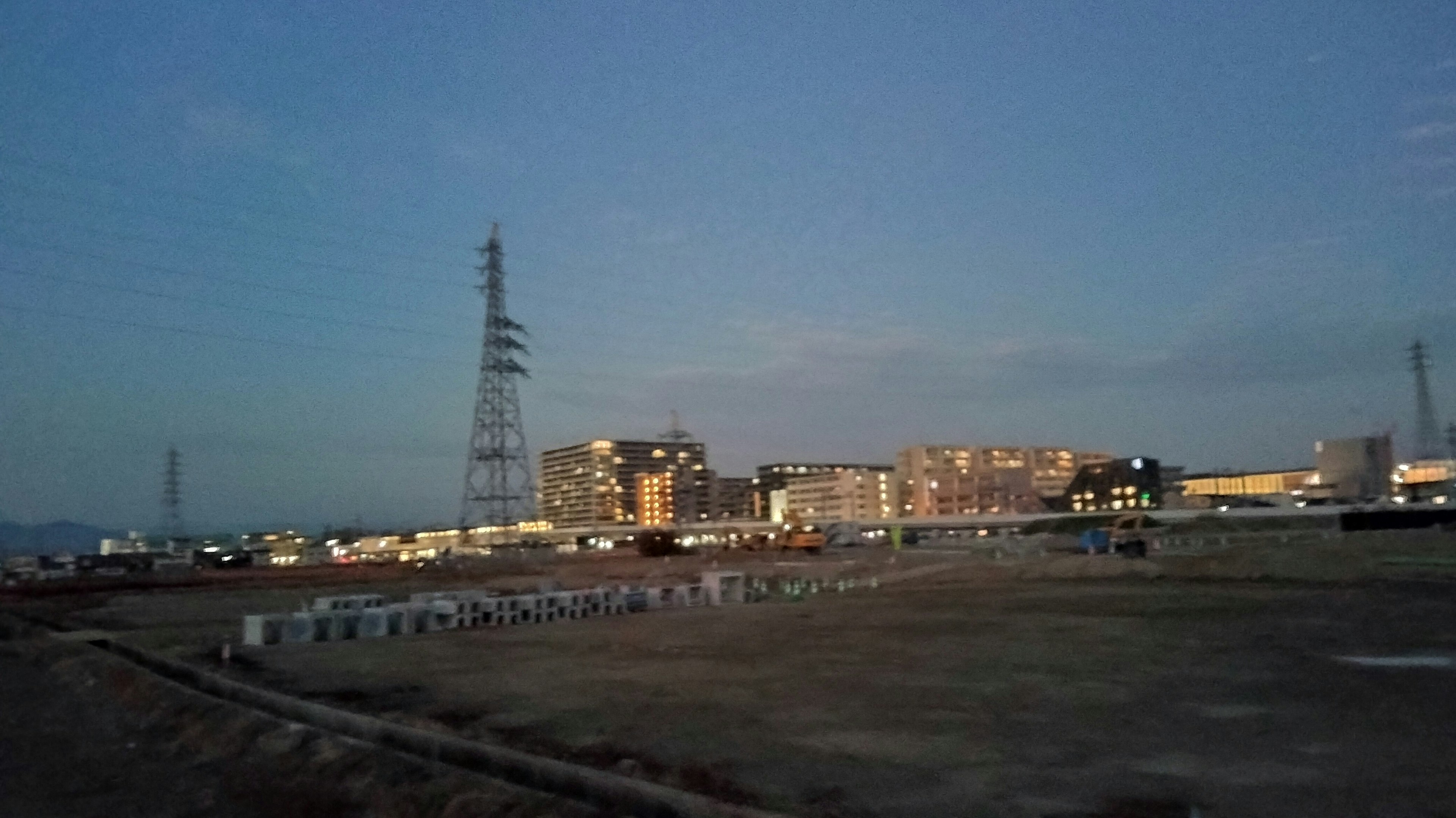 Urban landscape at dusk with power lines