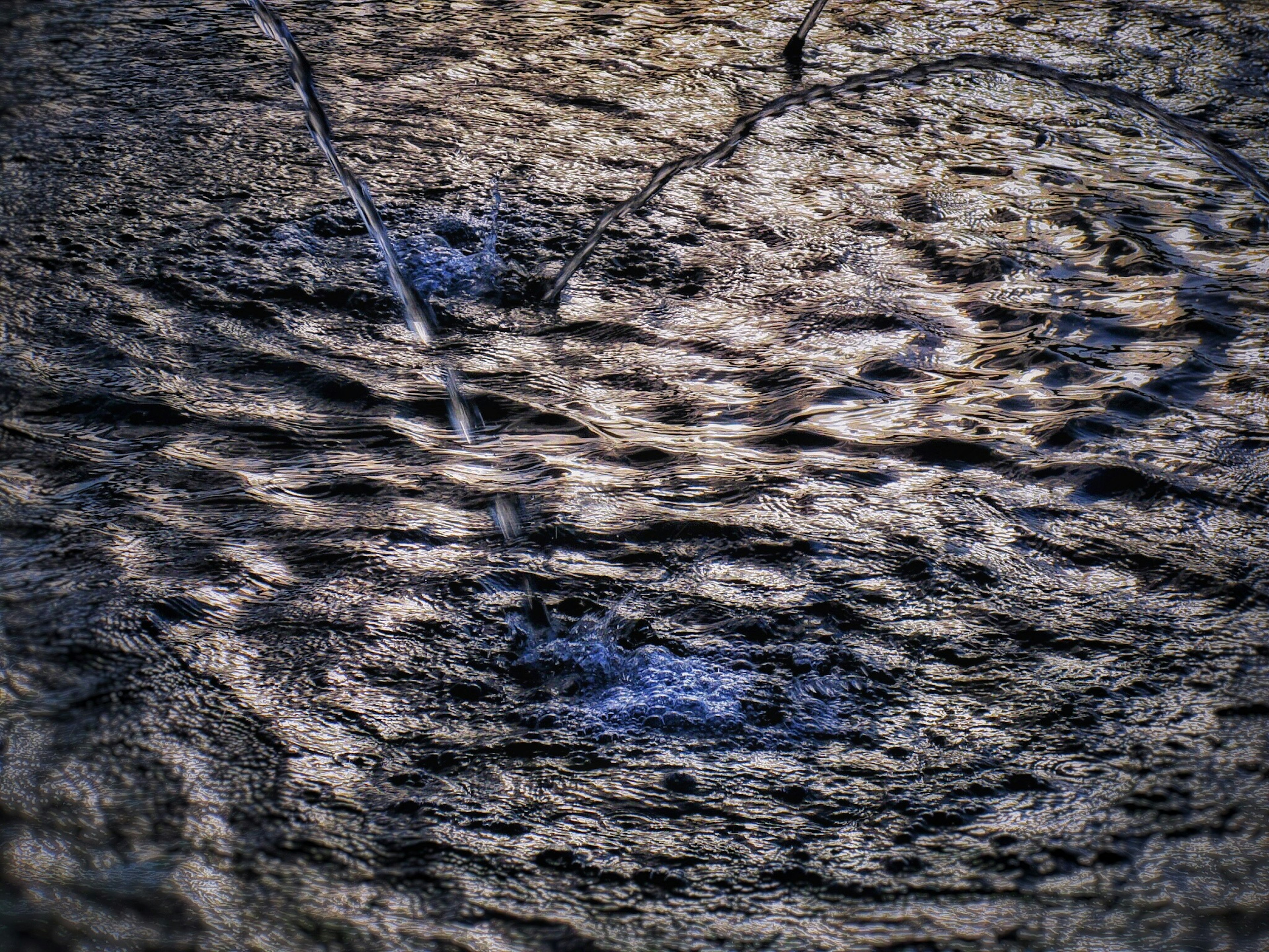 Close-up of a textured wooden surface with wavy patterns