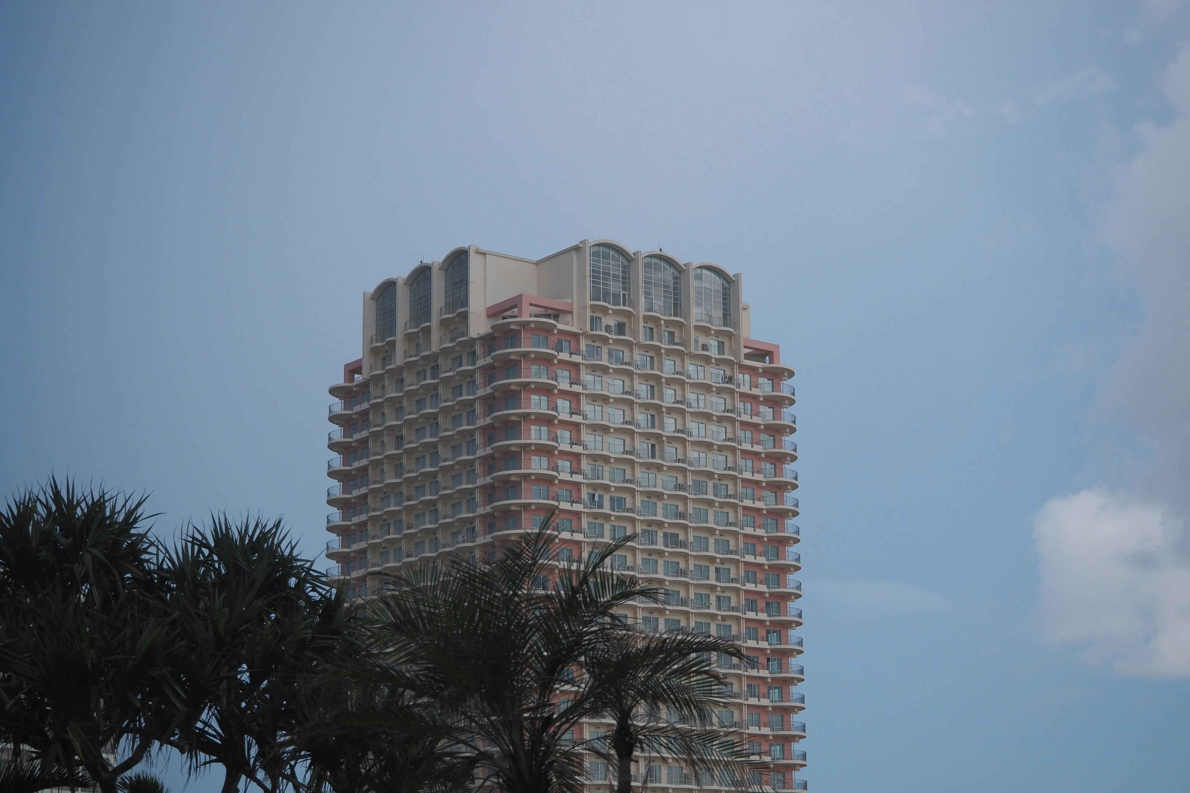 High-rise building exterior against blue sky