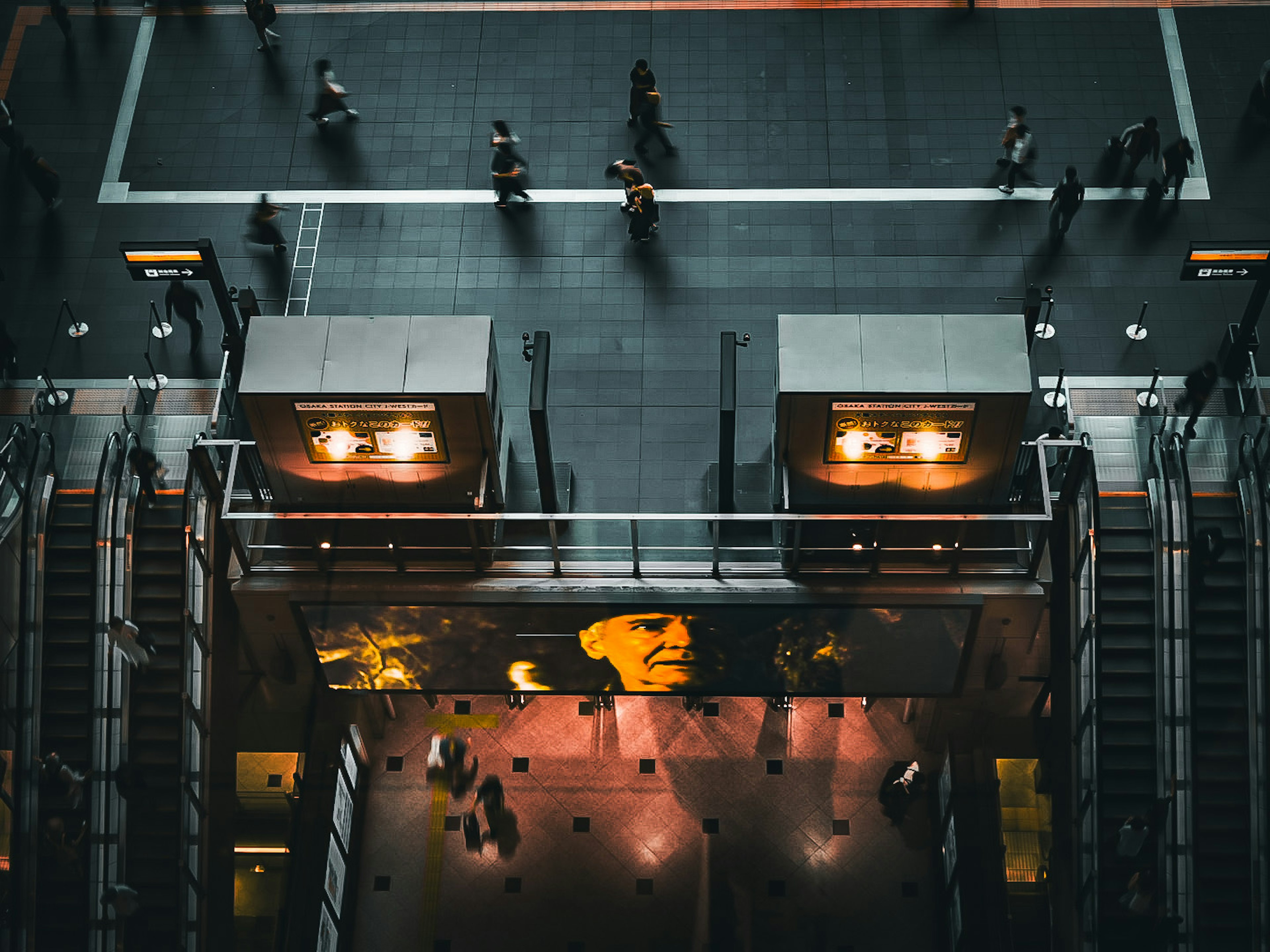 Aerial view of a city intersection with people walking Bright lights and modern architecture