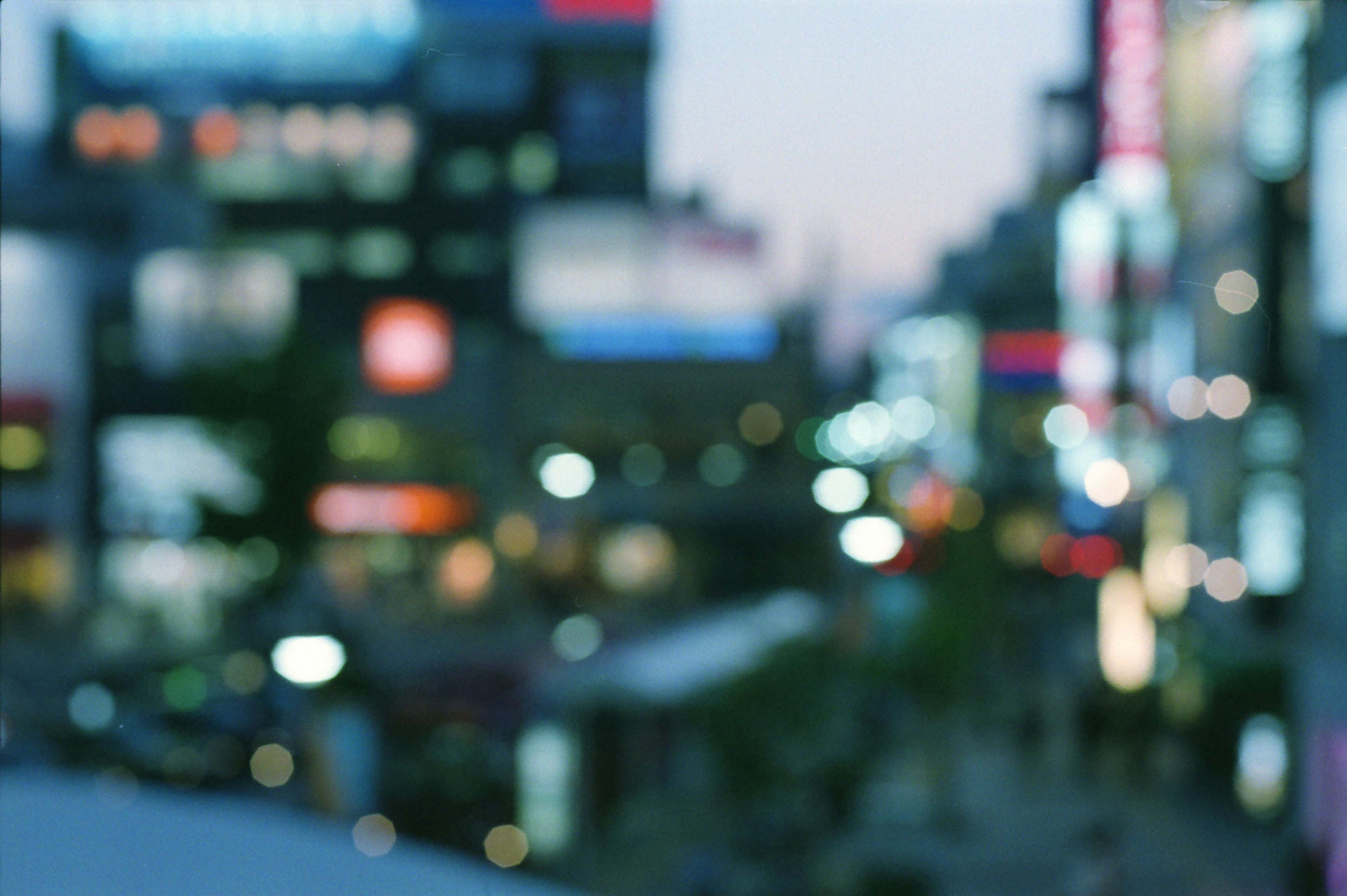 Blurred cityscape with bright neon lights