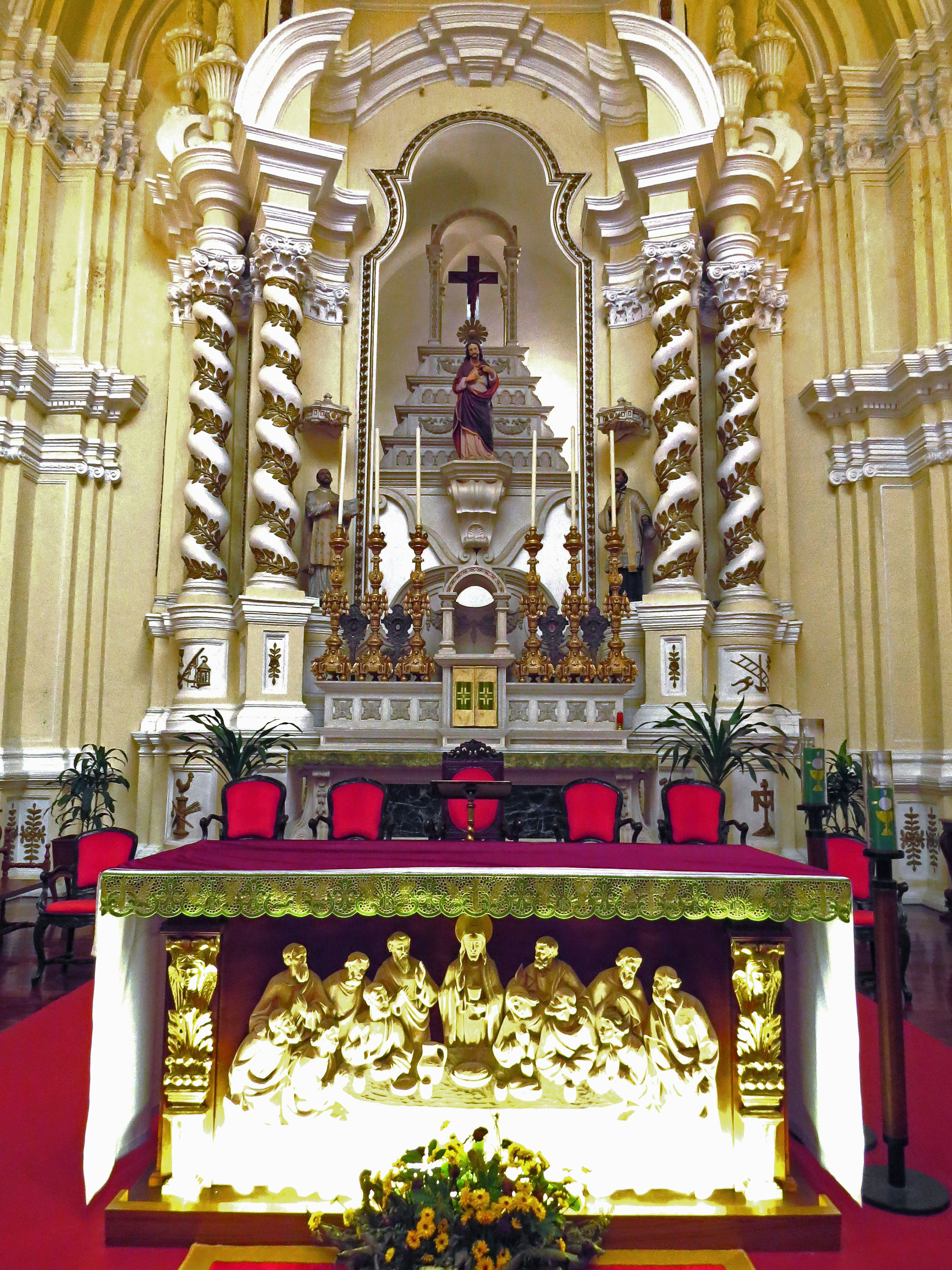 A beautiful church altar adorned with golden decorations and sculptures