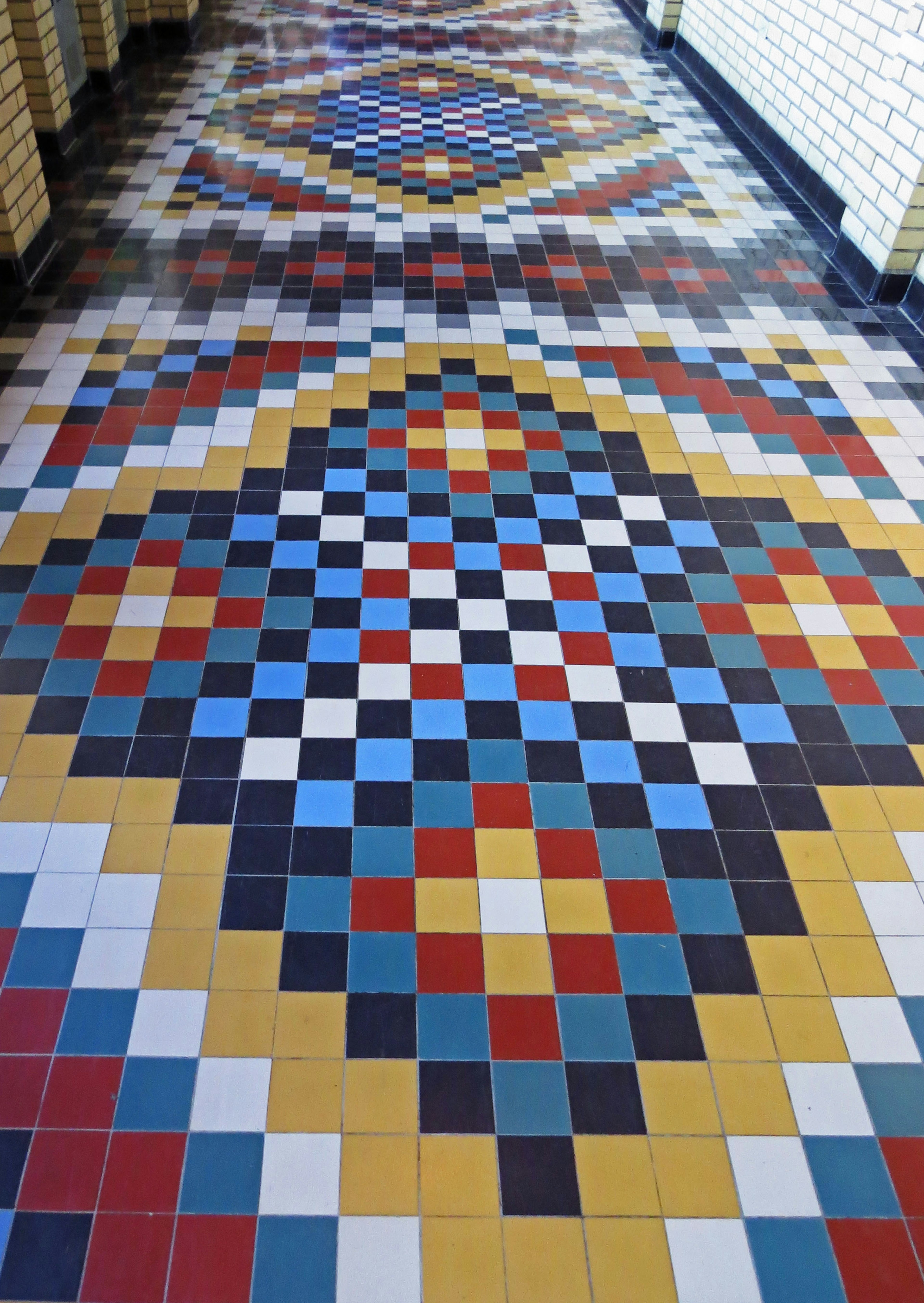 Colorful tiled floor design in a hallway