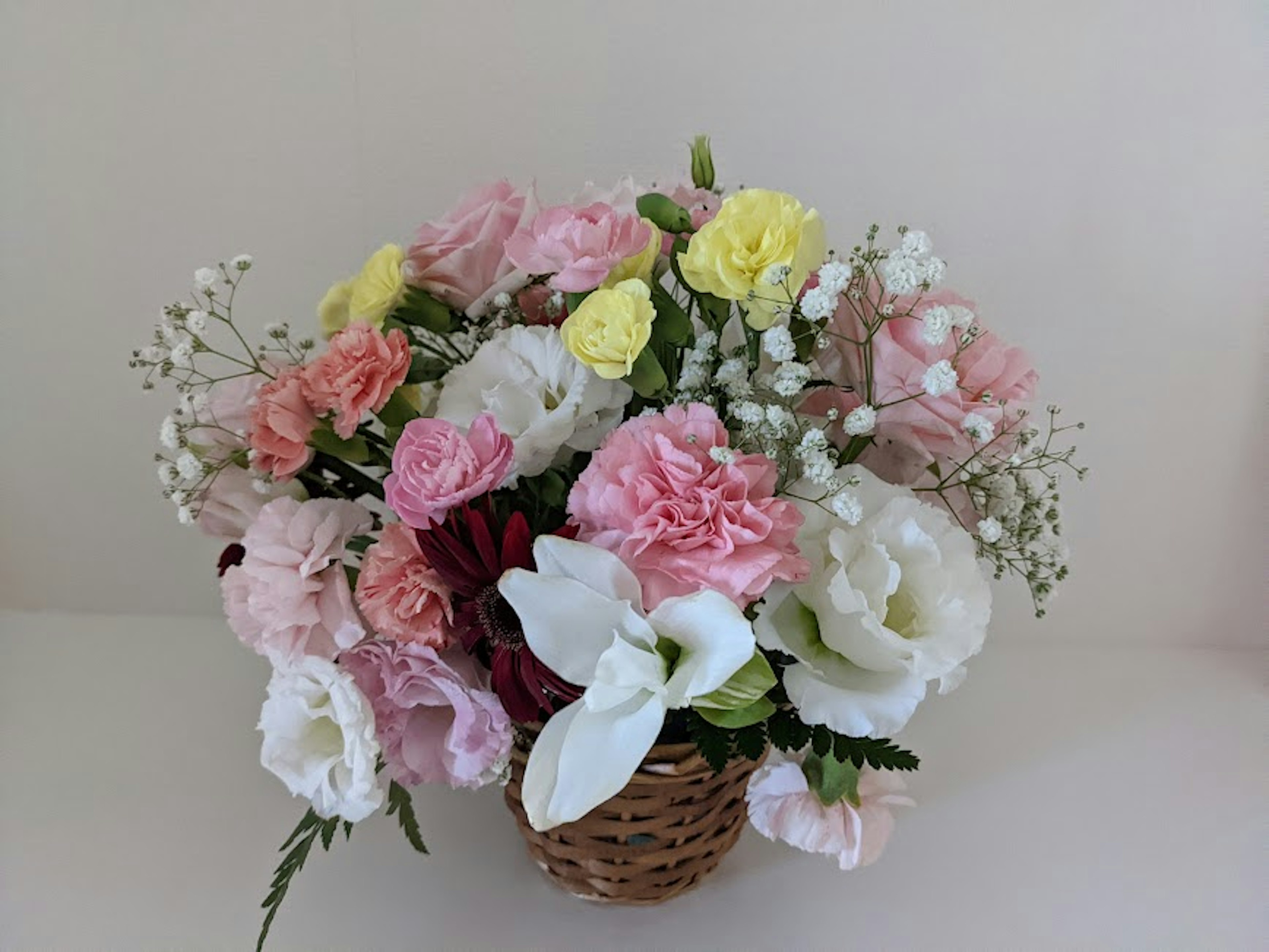 Colorful bouquet arranged in a basket