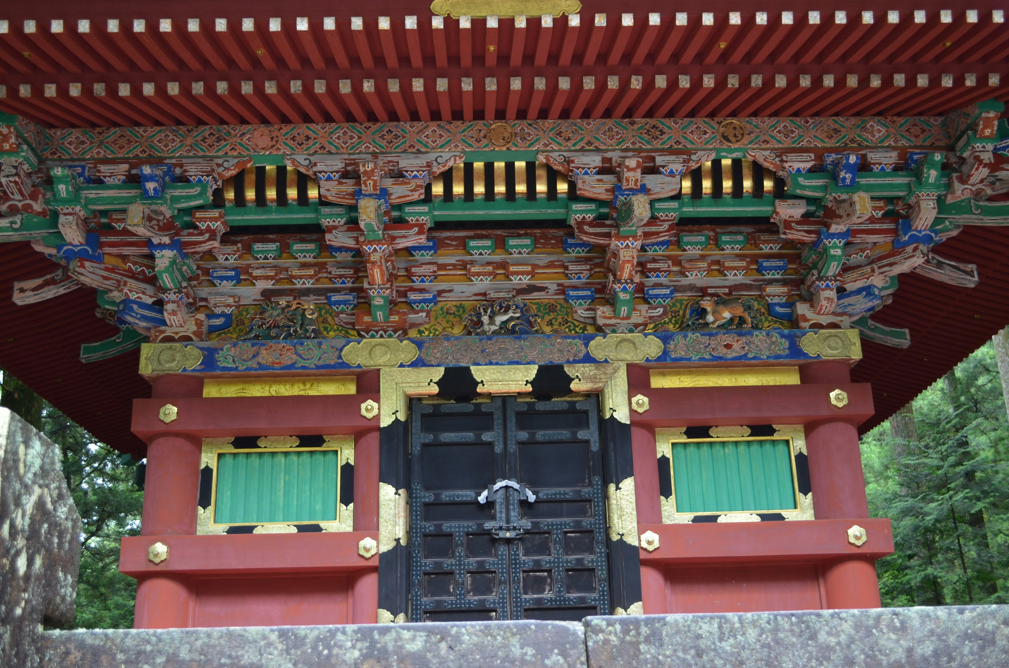 Traditional Japanese temple gate with vibrant decorations