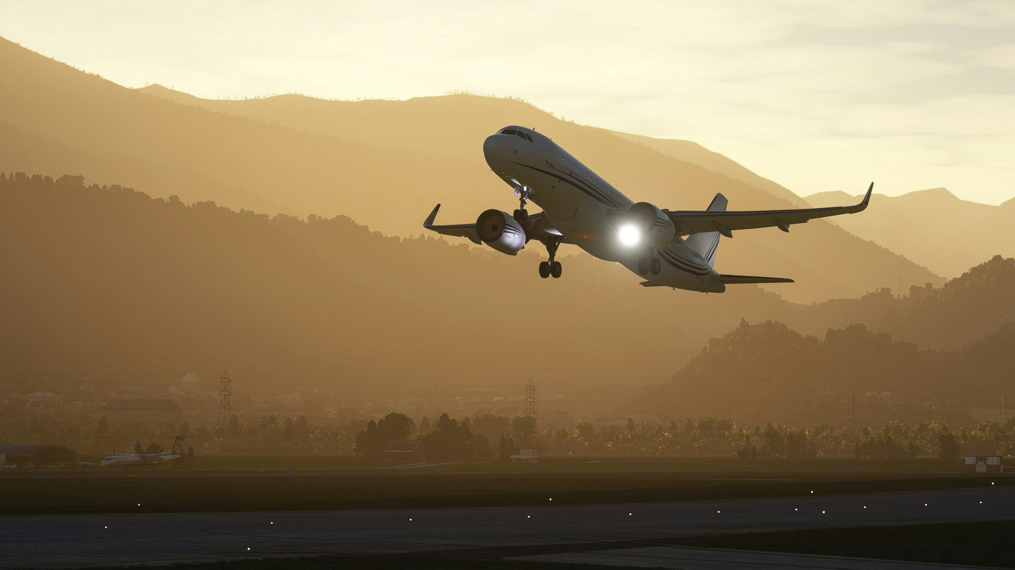 Silhouette di un aereo in decollo con sfondo di tramonto