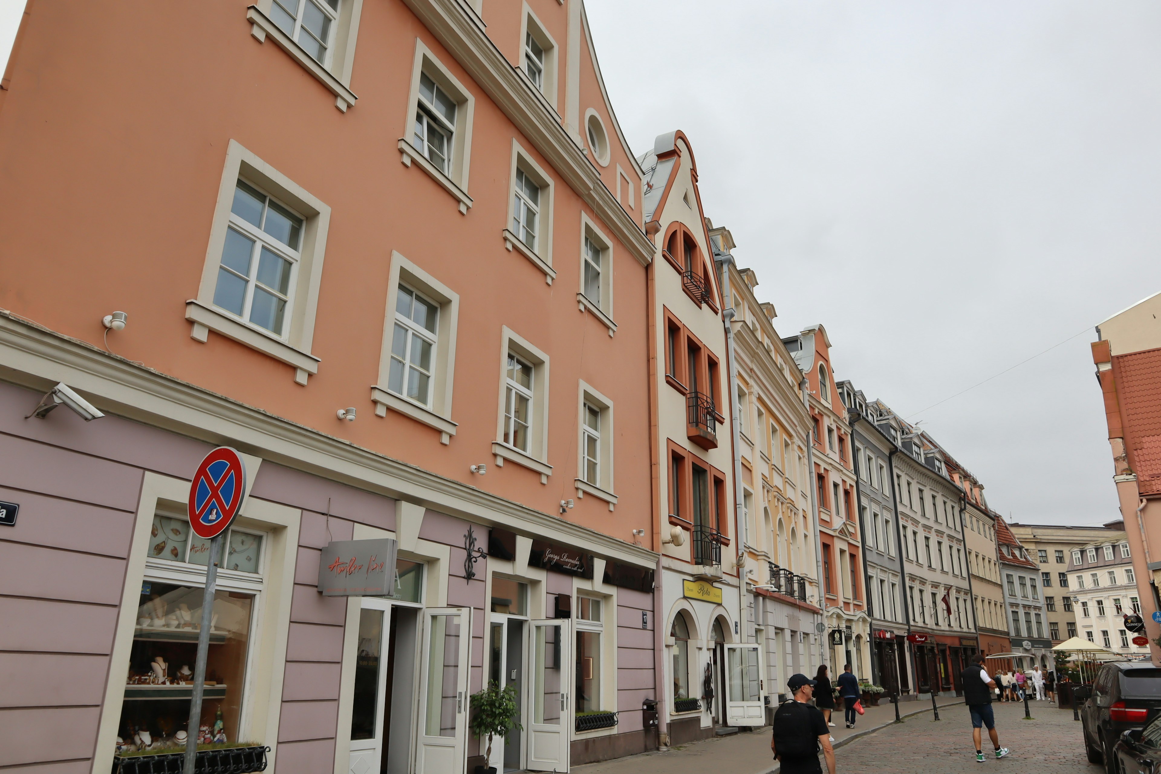 Street view with colorful buildings and people walking