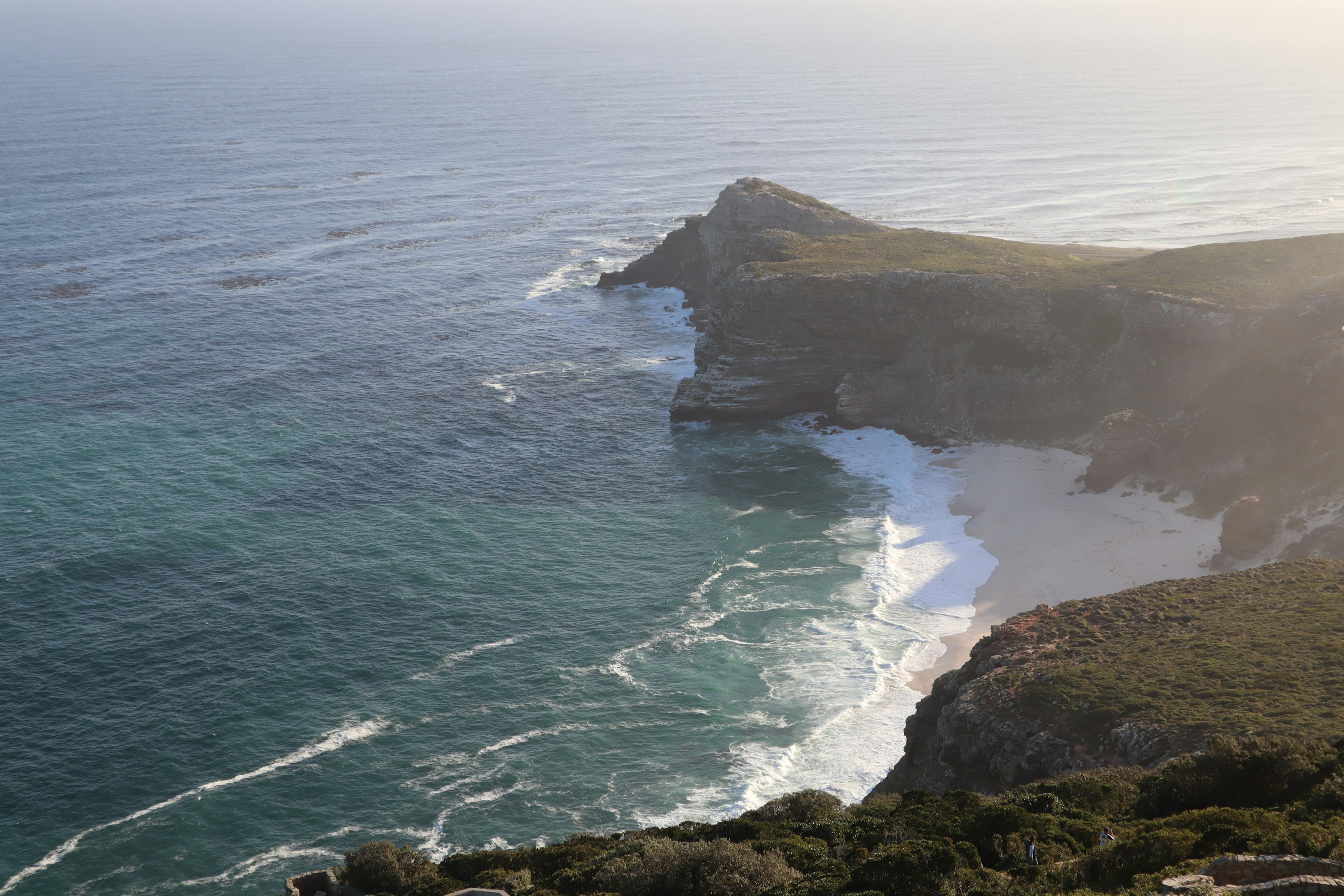 Scenic coastline with waves crashing onto the shore