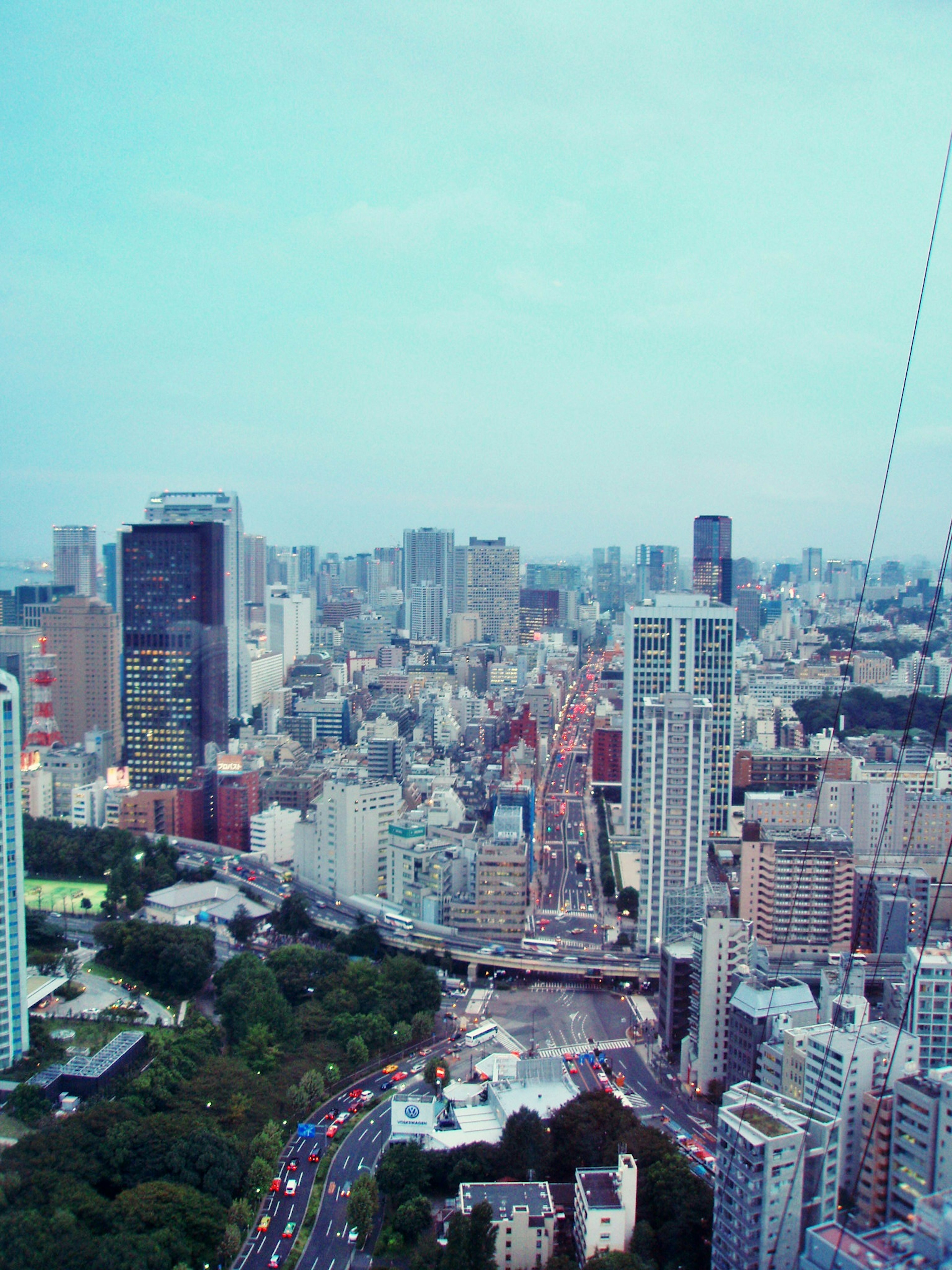 Aerial view of Tokyo showcasing skyscrapers and a clear blue sky