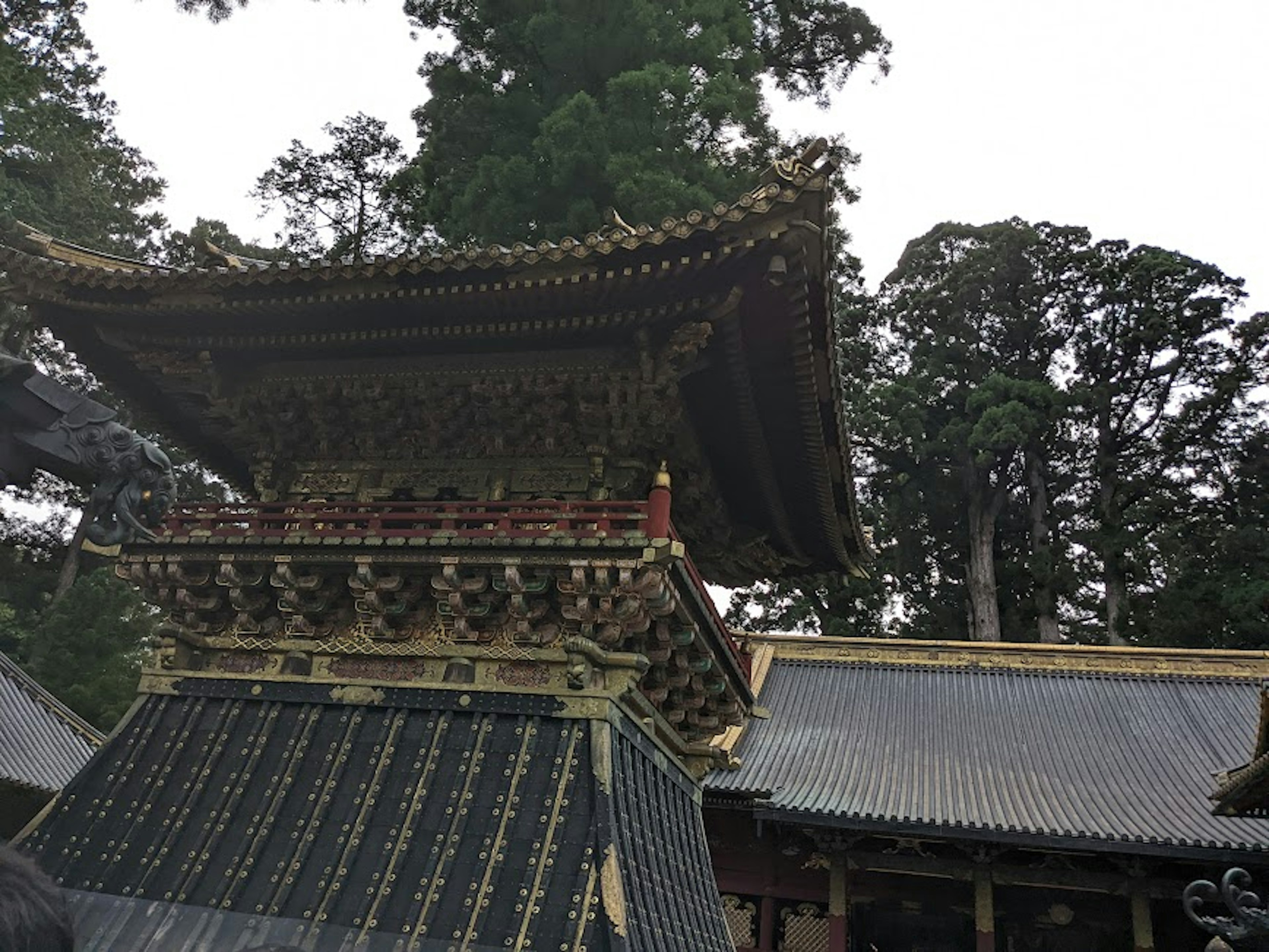 Detailed view of a traditional Japanese shrine roof with intricate decorations