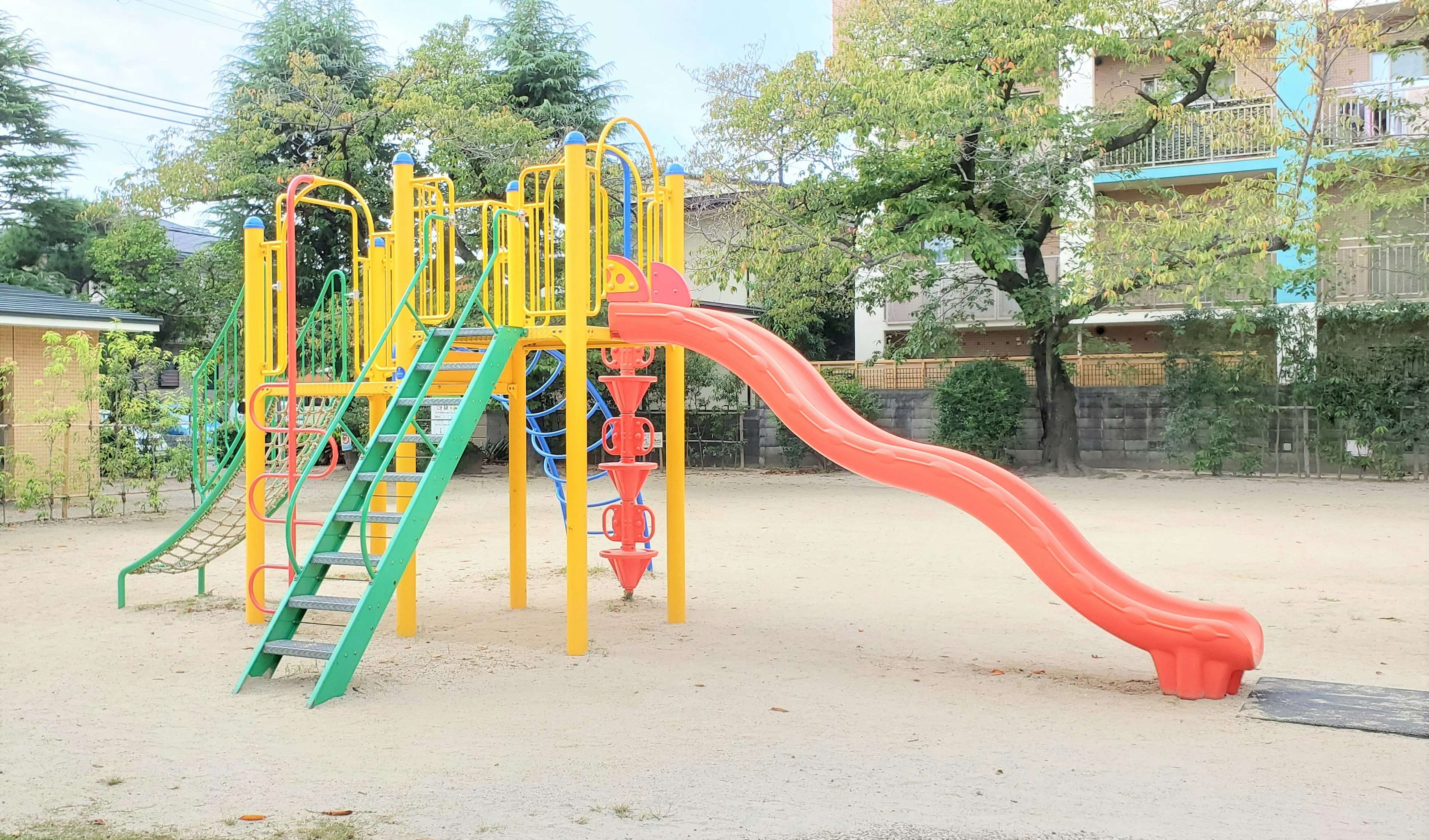 Colorful playground equipment with slide in a park