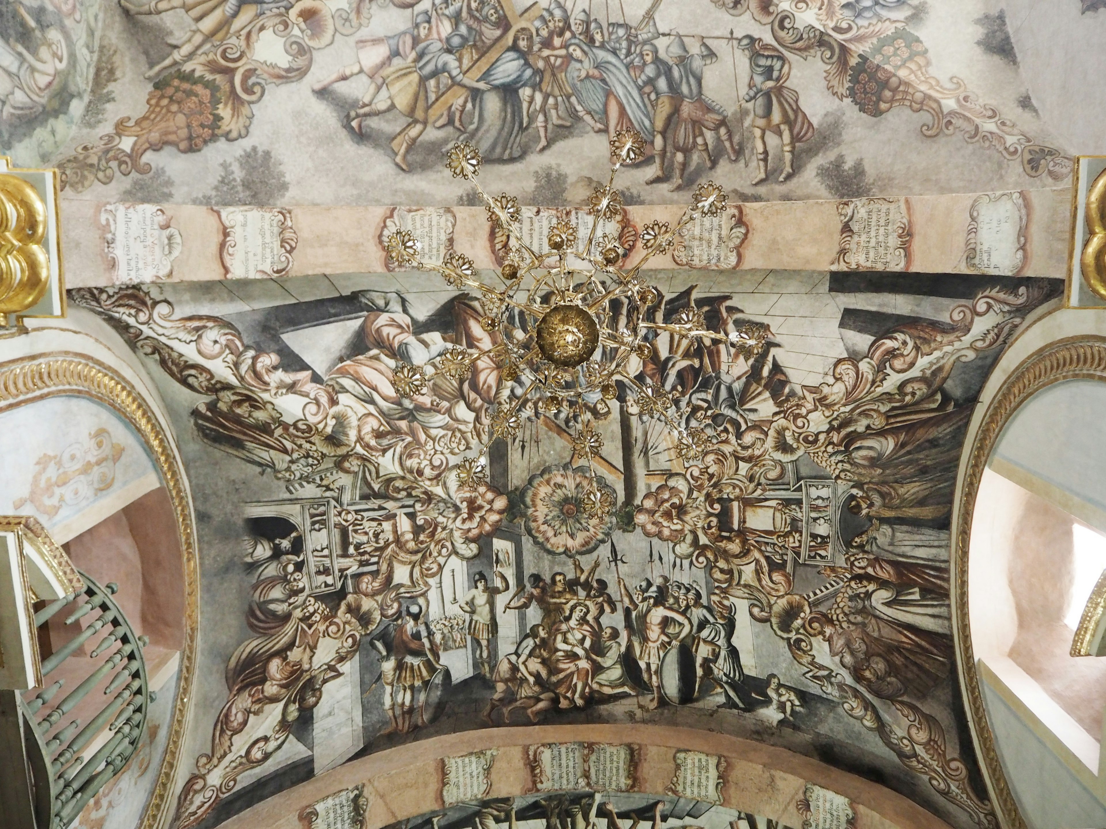 Interior of a church featuring a grand ceiling fresco