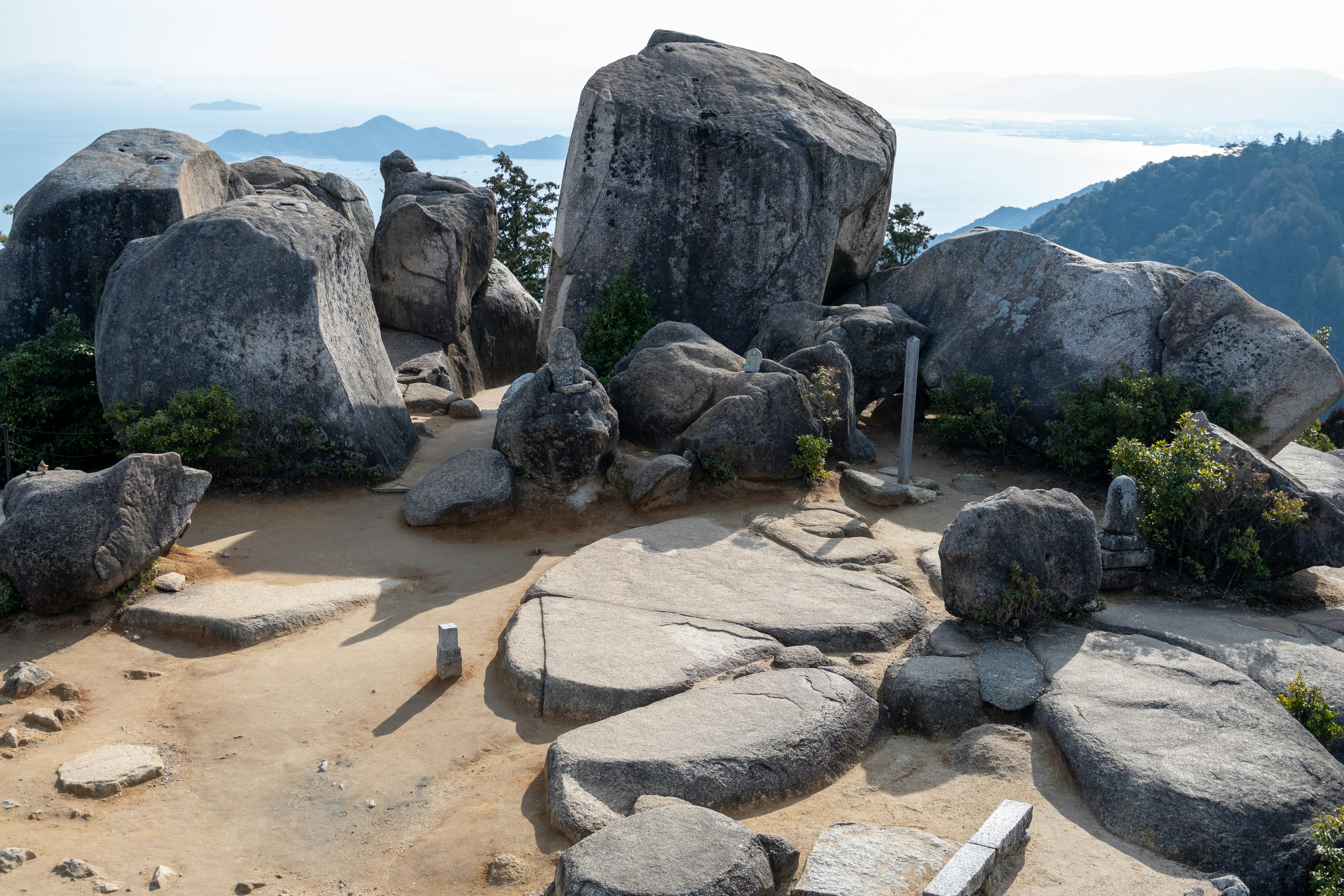 Landscape featuring large rocks and sandy ground