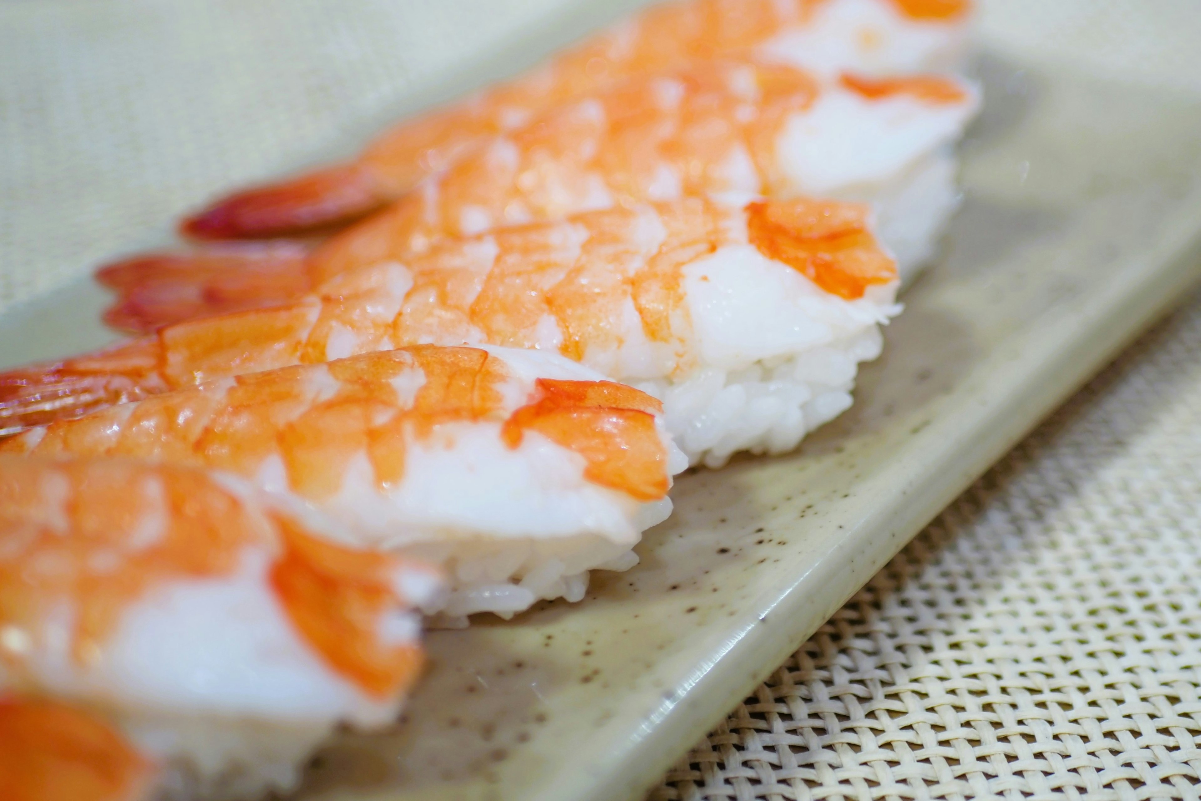 Image of shrimp nigiri sushi arranged on a plate