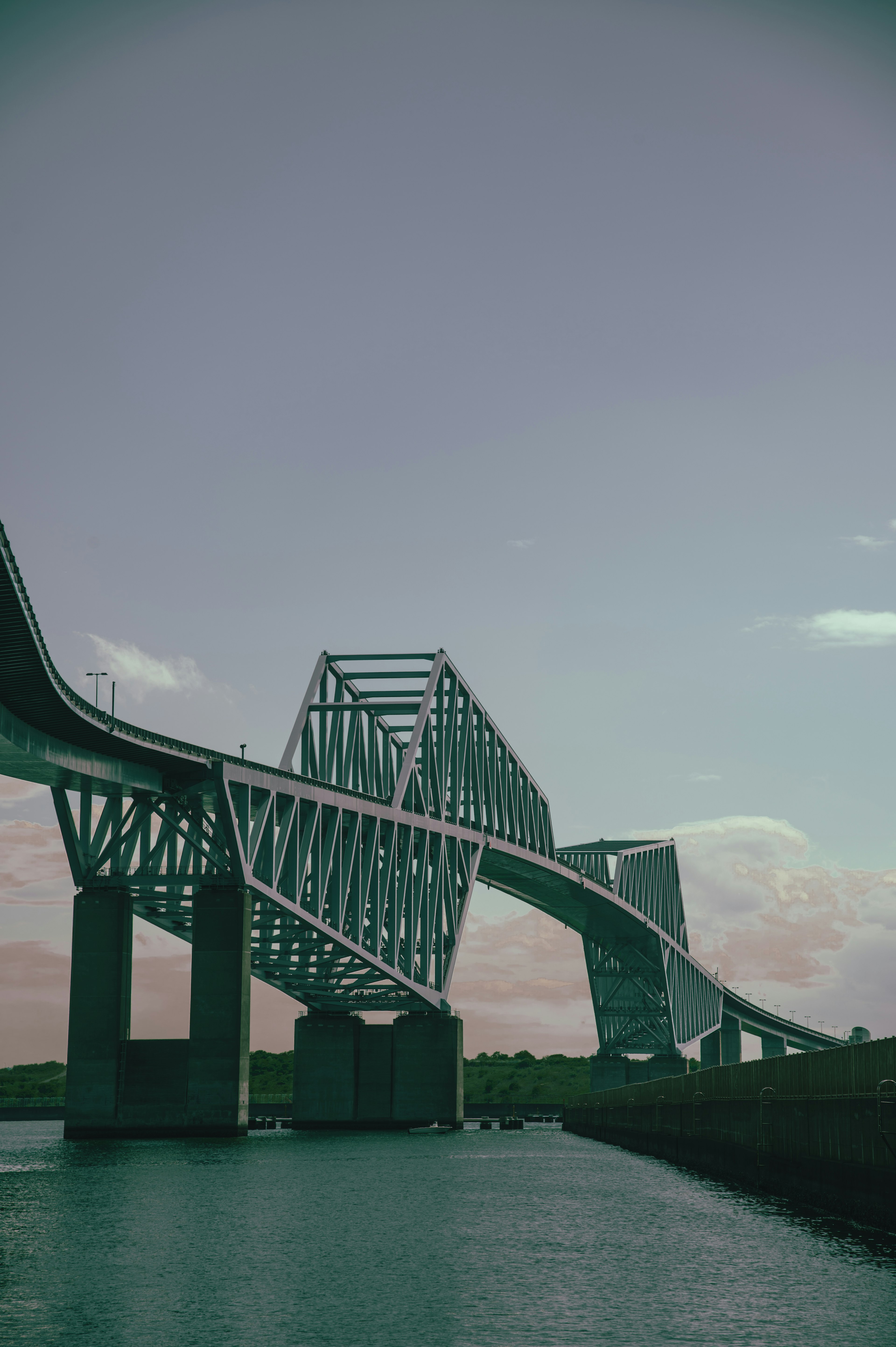 A modern bridge structure over calm waters