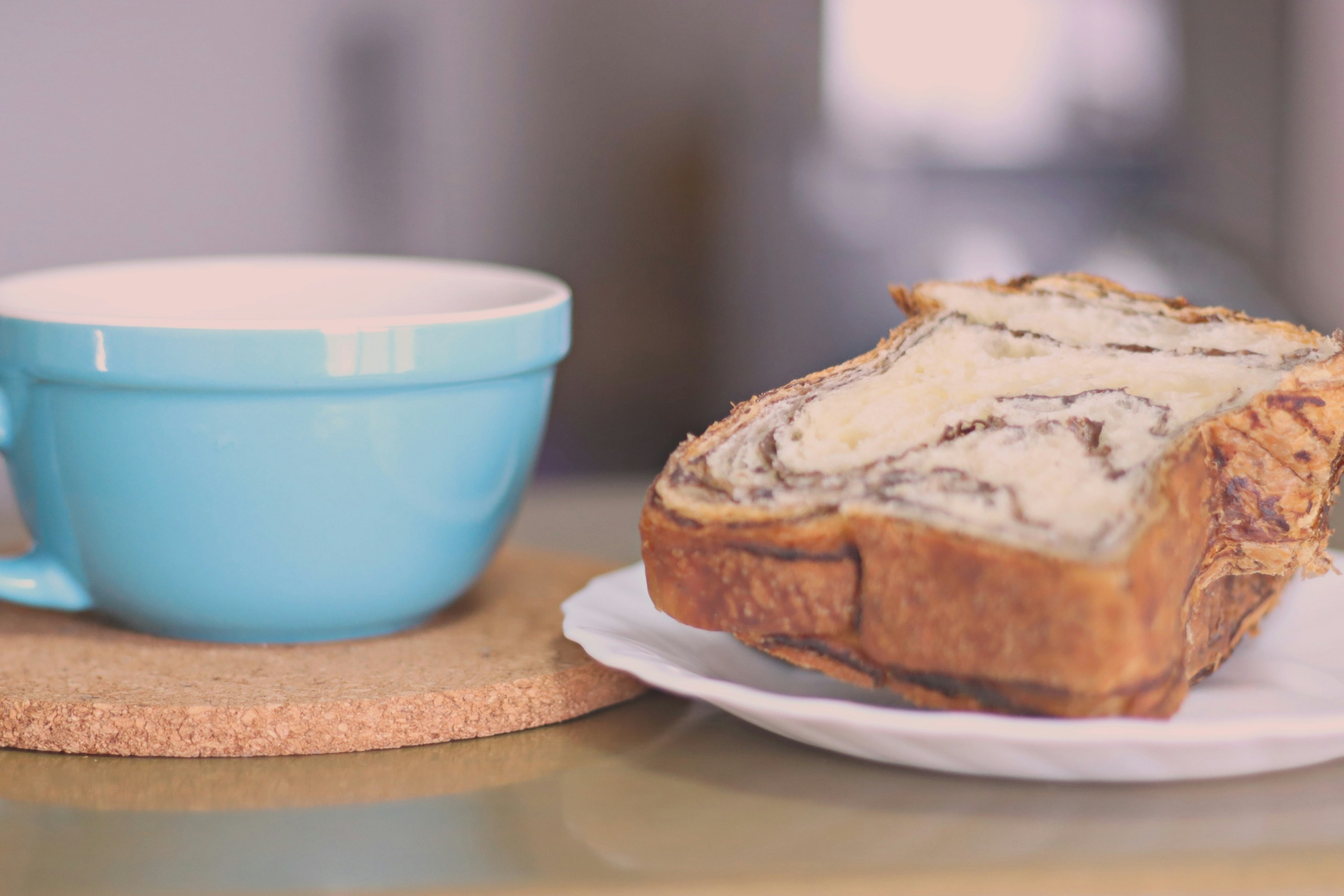 Image of a blue bowl and a slice of bread