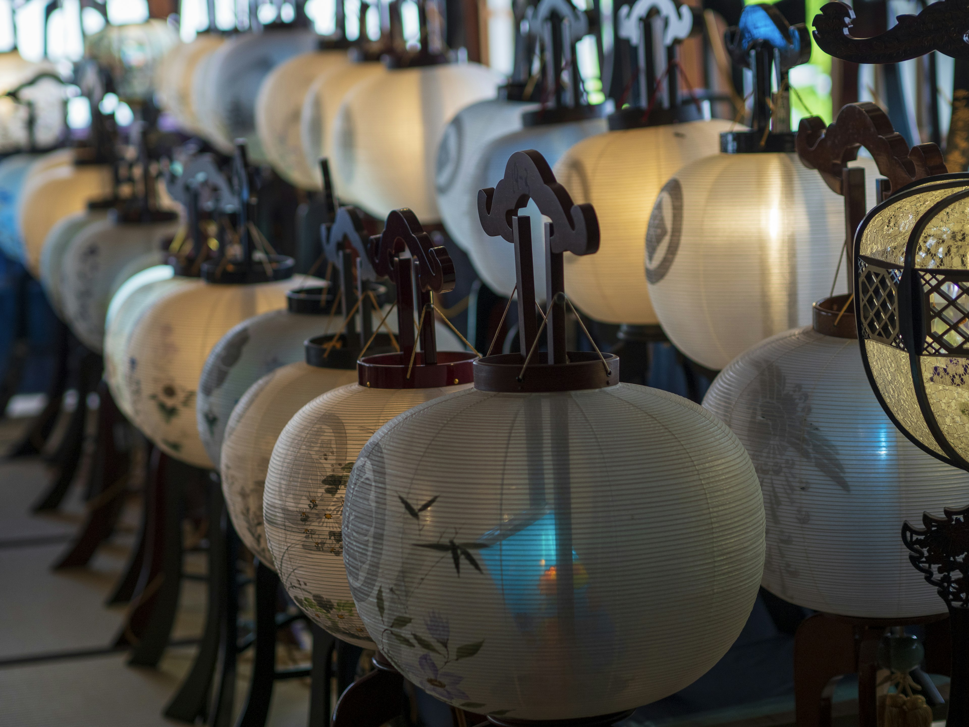 A row of decorative lanterns with intricate designs