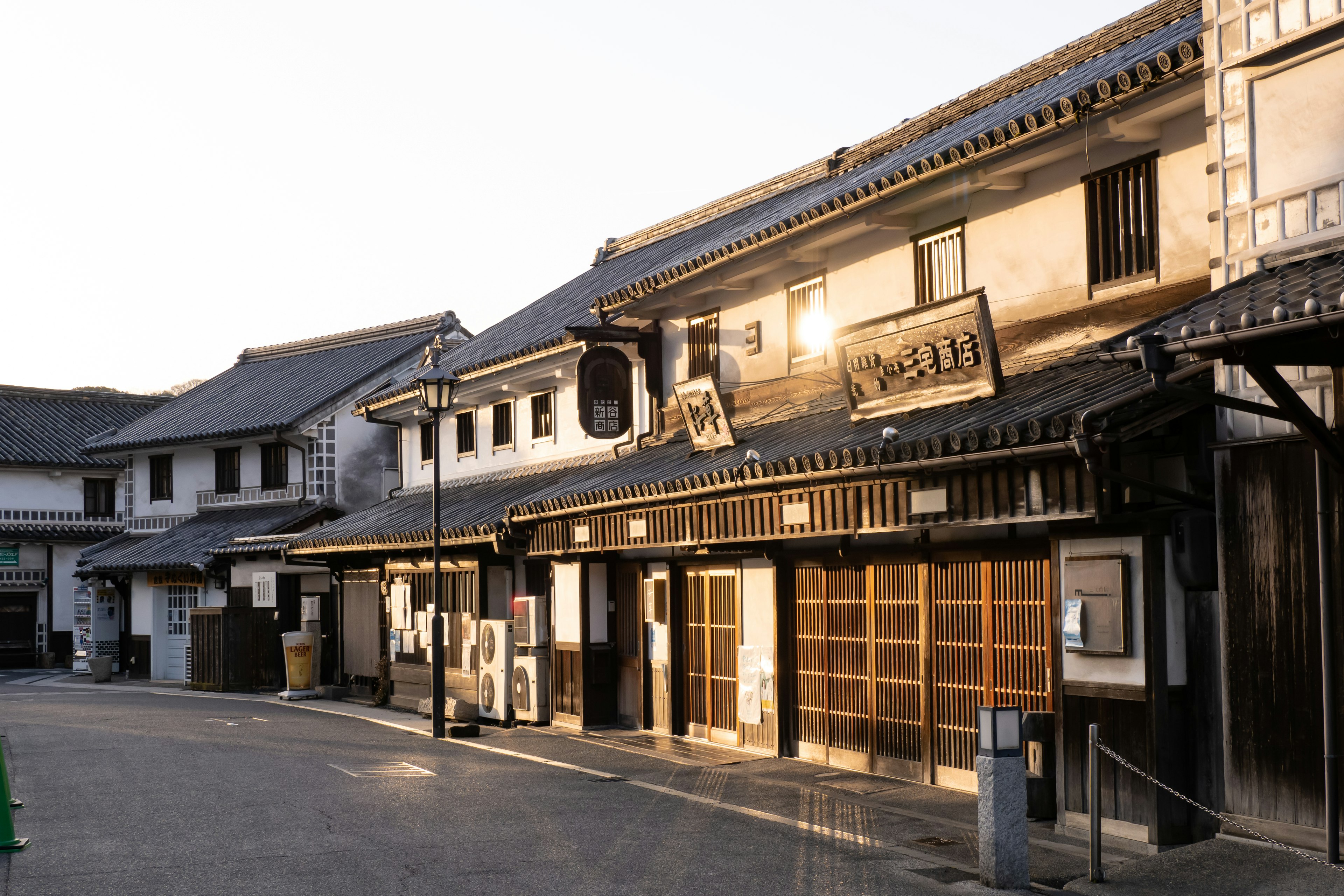 Traditional Japanese buildings line a quiet street