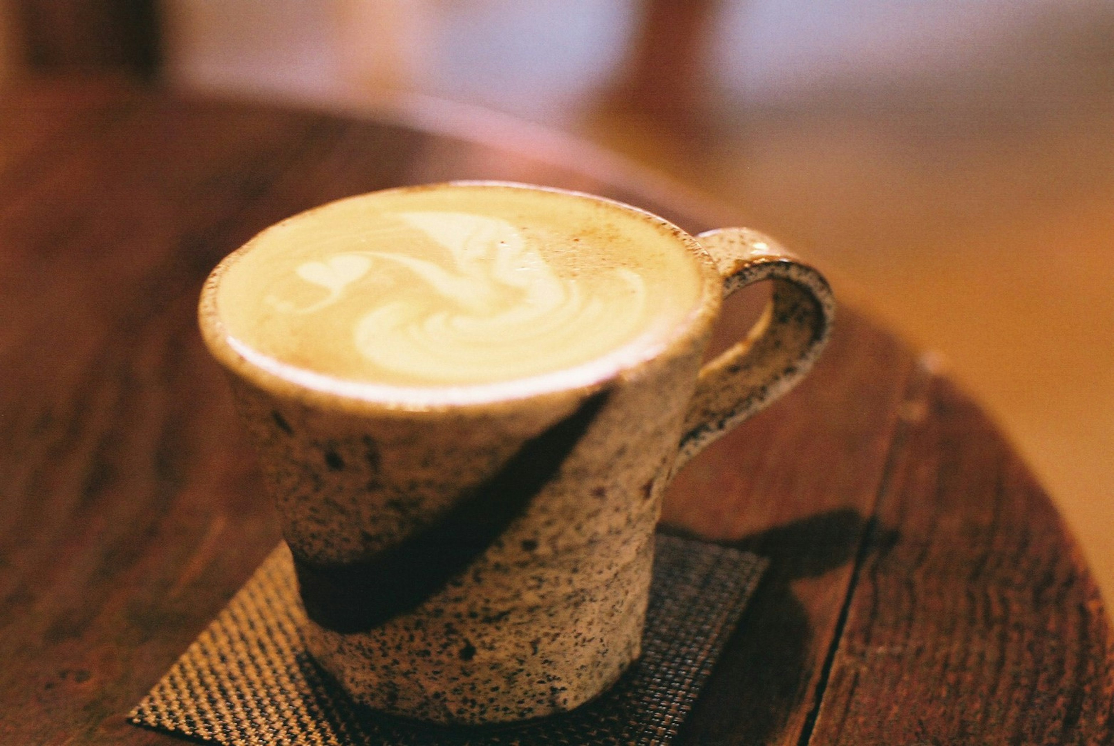 Creamy latte art in a ceramic cup