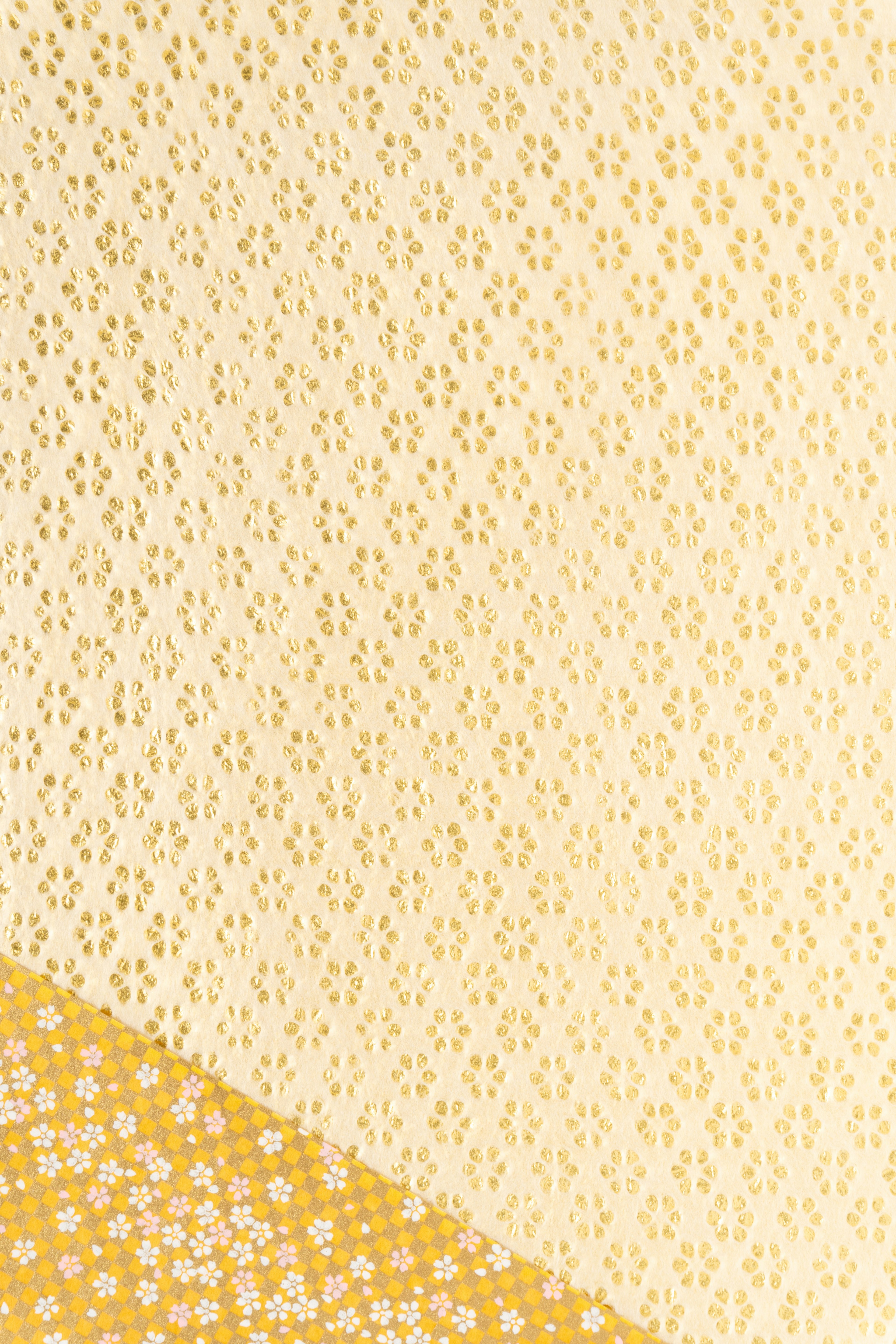 Close-up of yellow lace patterned fabric showcasing intricate texture