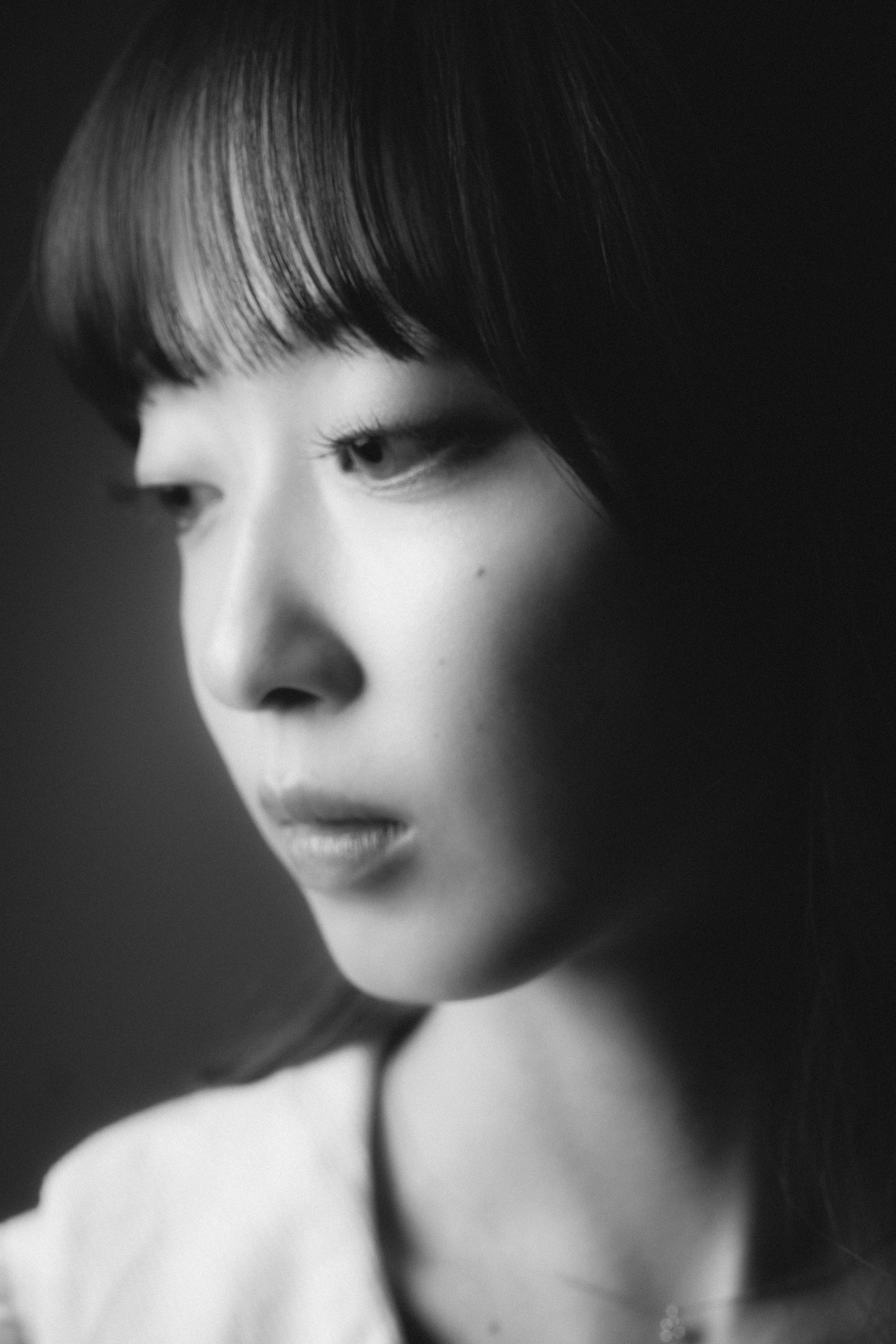 Black and white portrait of a woman lost in thought