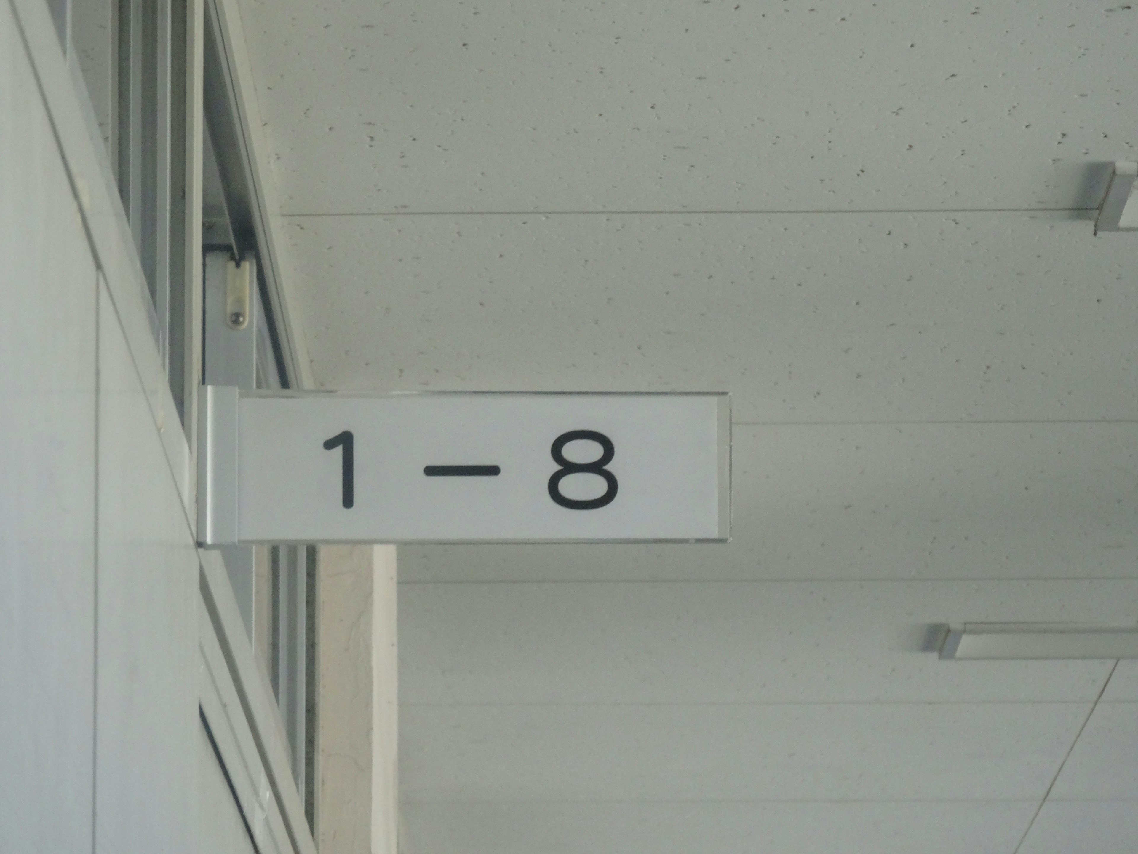 Sign displaying numbers 1 to 8 in a simple design