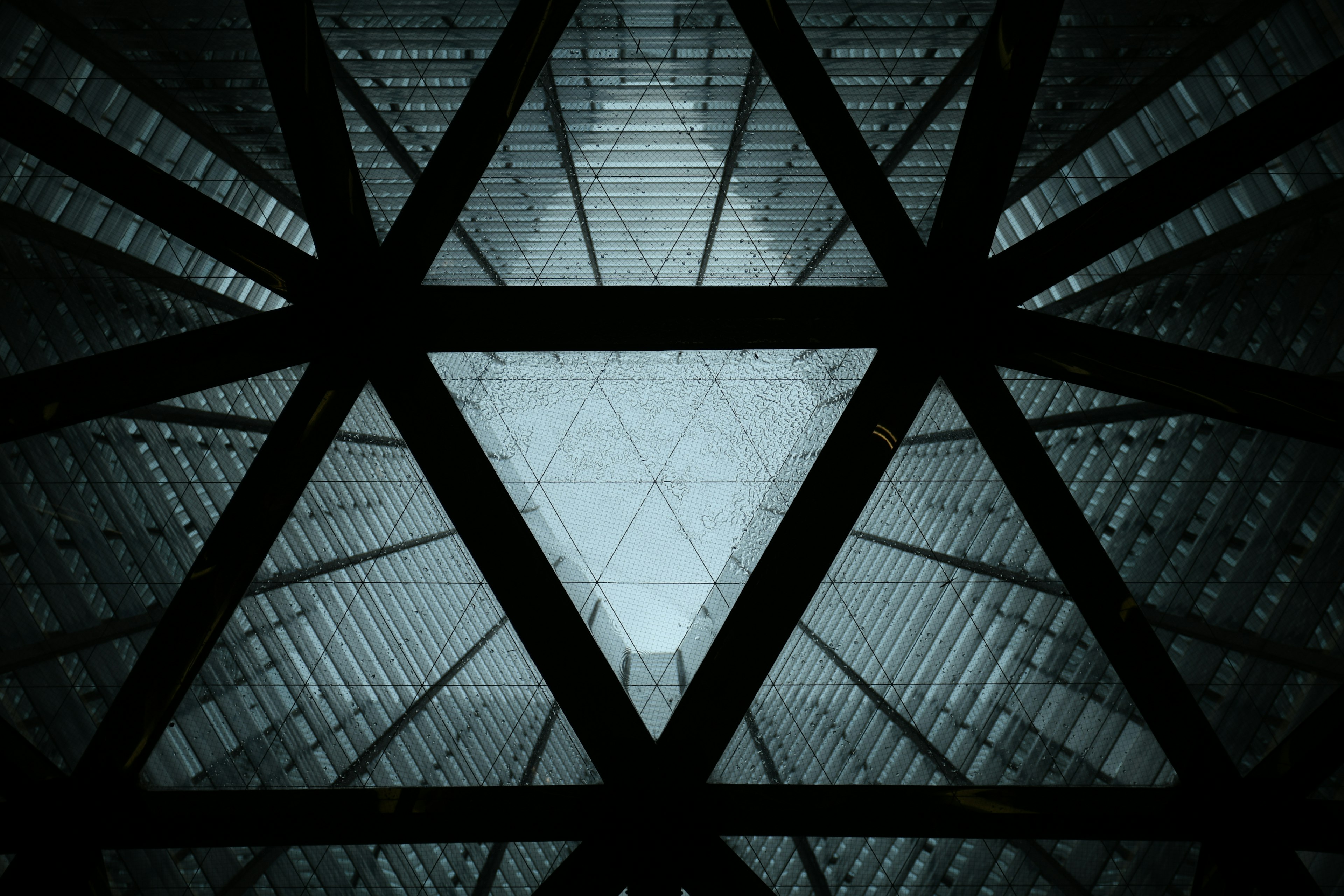 View from below a triangular glass ceiling structure