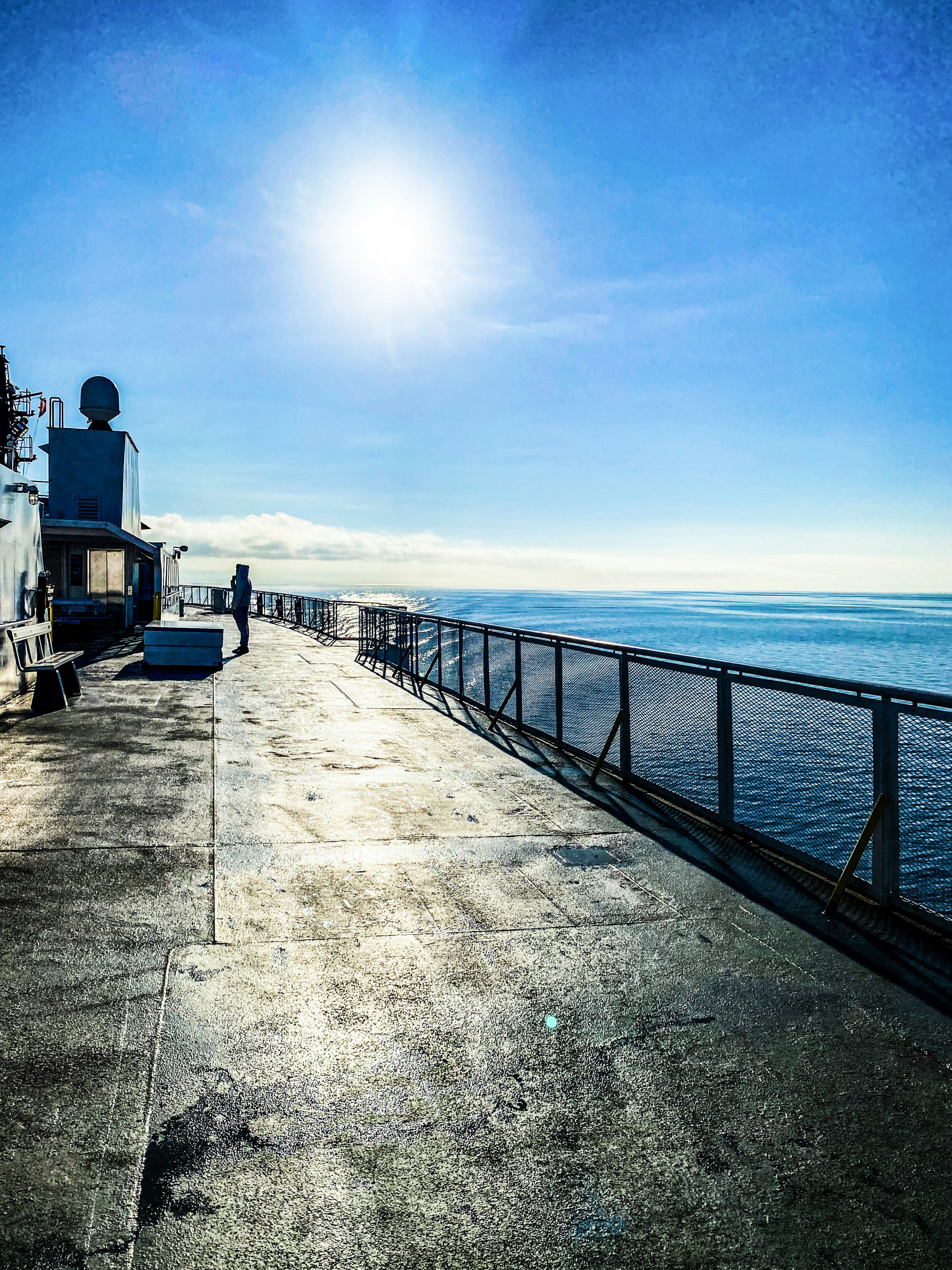 Deck view with bright sun and blue ocean