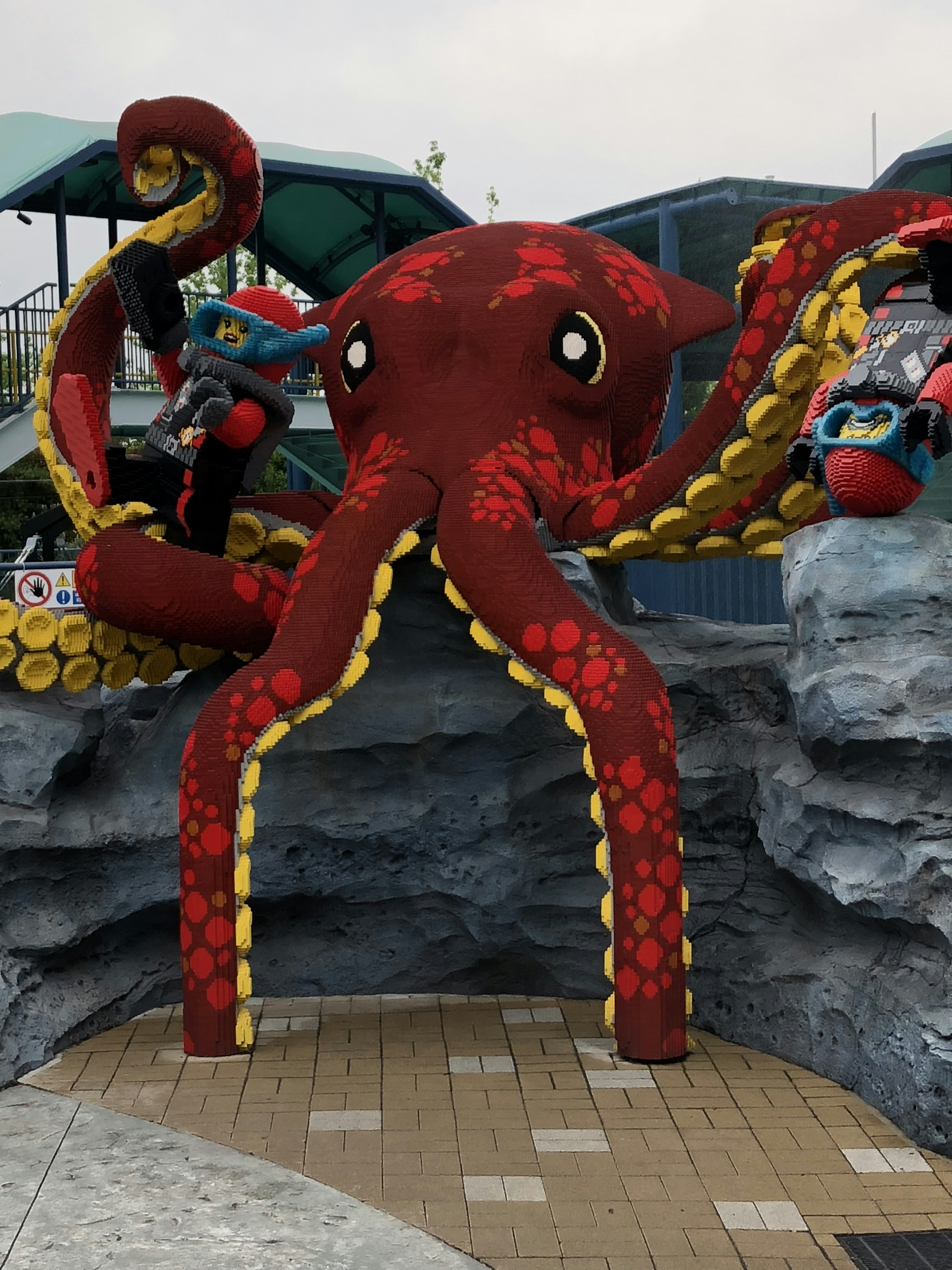 Playground featuring a large red octopus sculpture