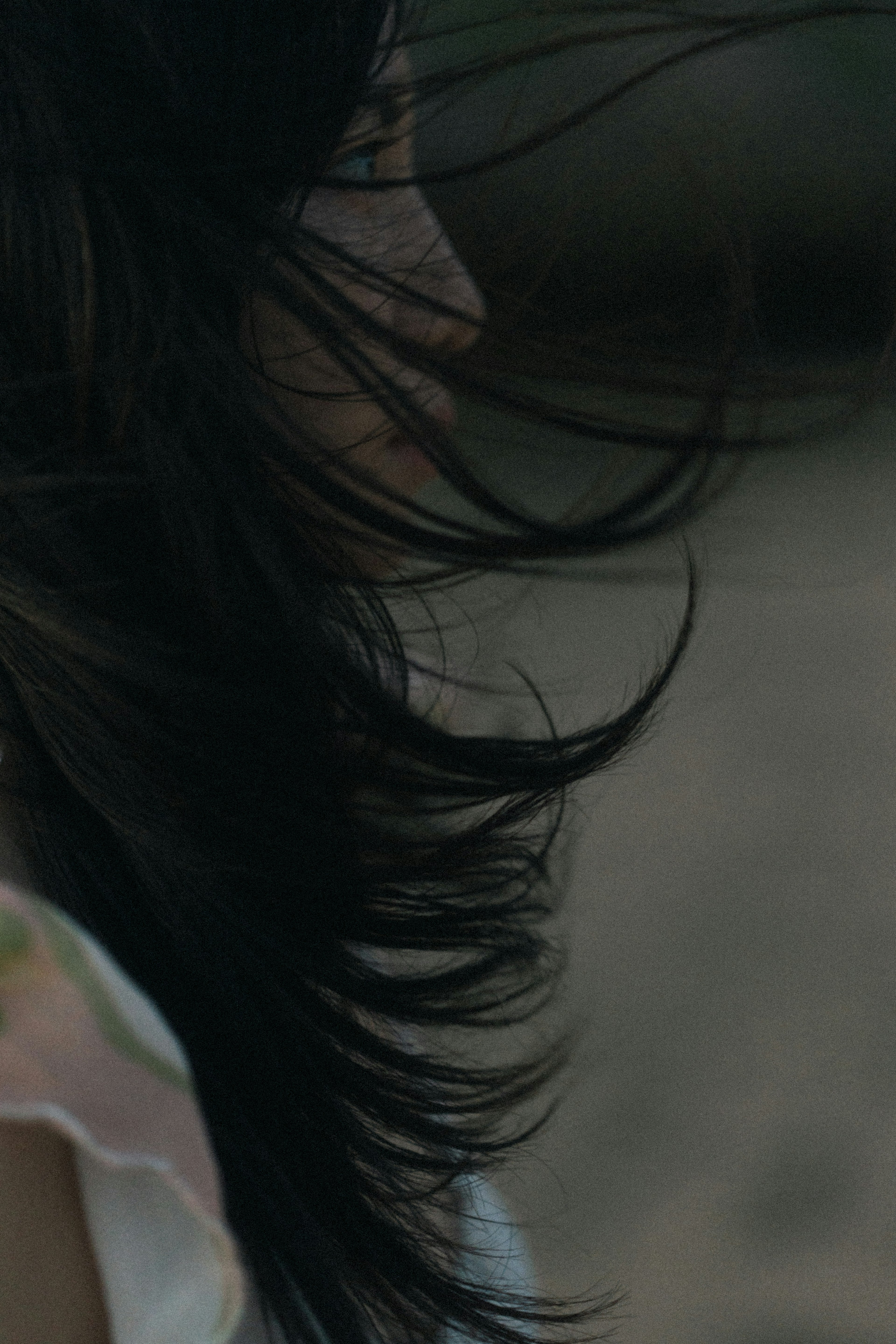 Profile of a woman with flowing hair in the wind