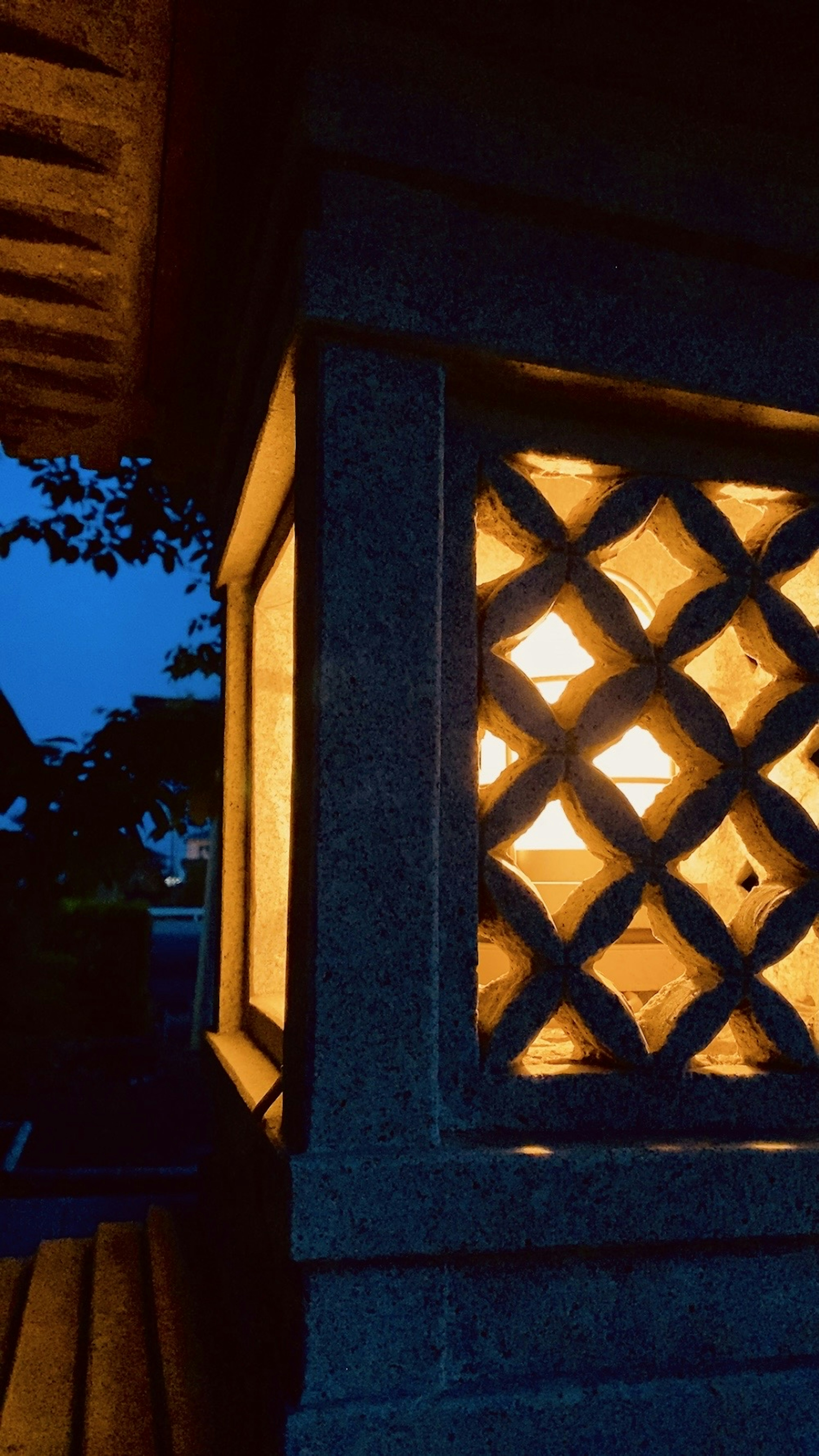 Close-up of a stone lantern illuminated at night