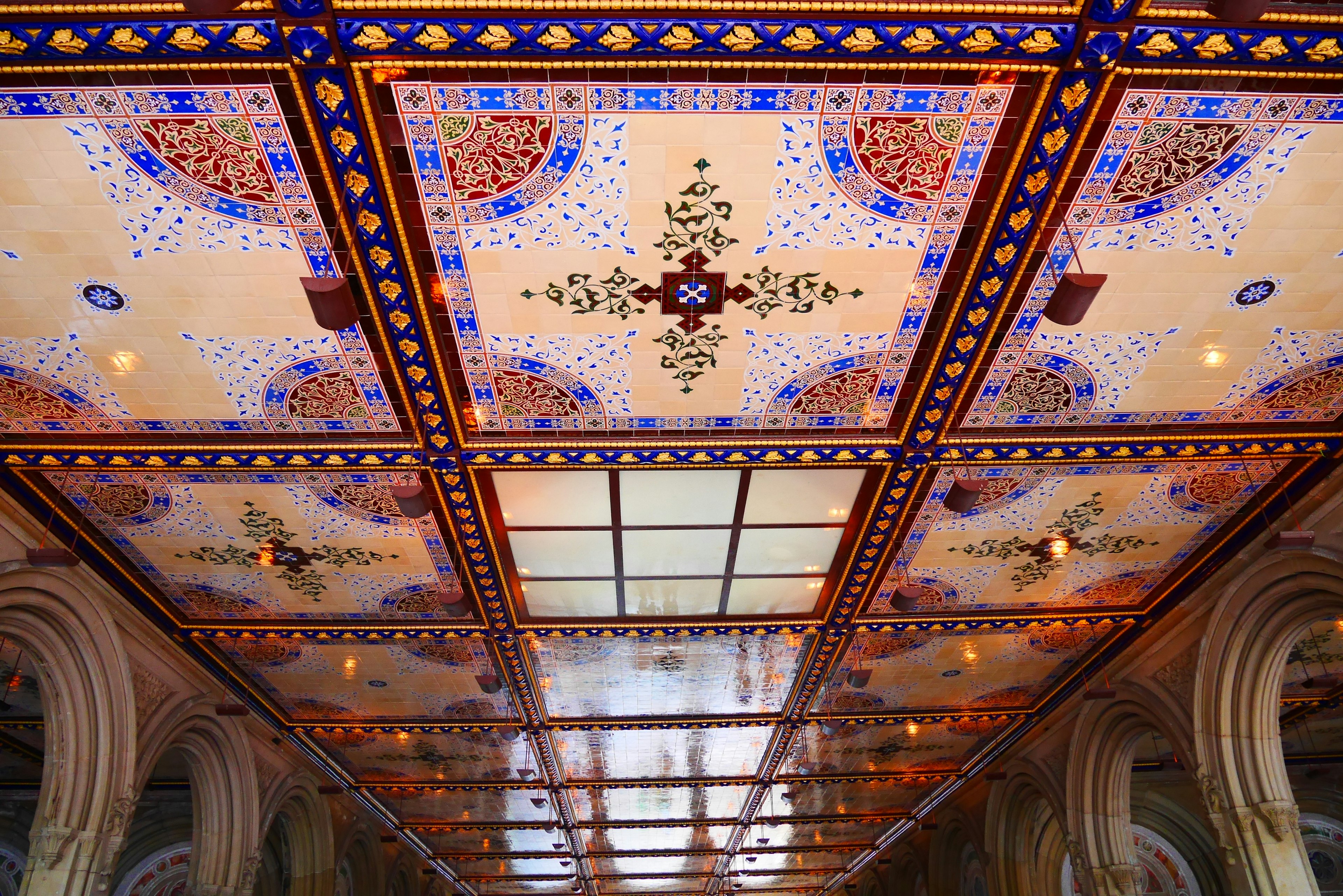 Image of a beautifully decorated ceiling featuring intricate patterns and vibrant colors