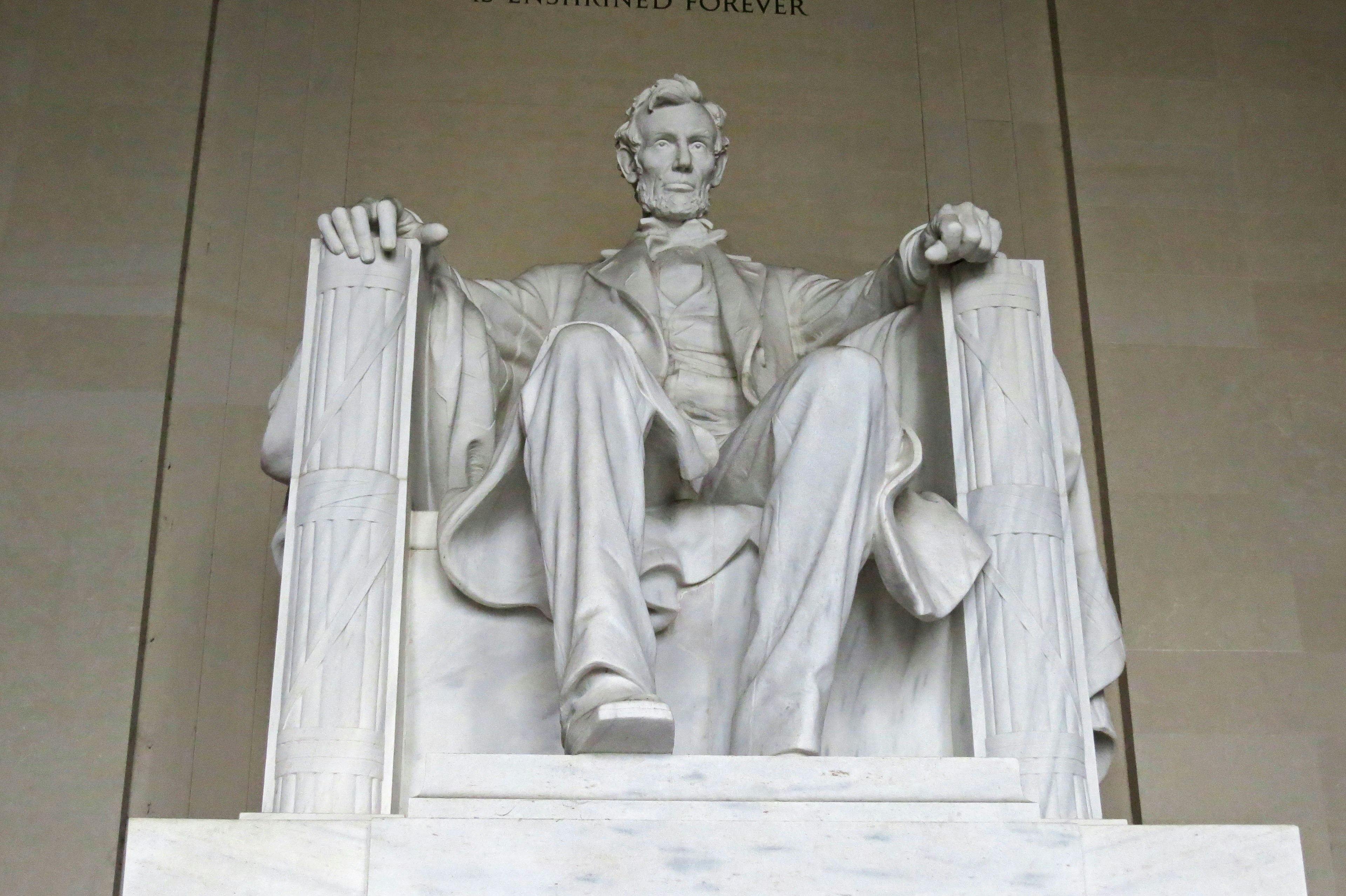 Marble statue of Abraham Lincoln seated in the Lincoln Memorial