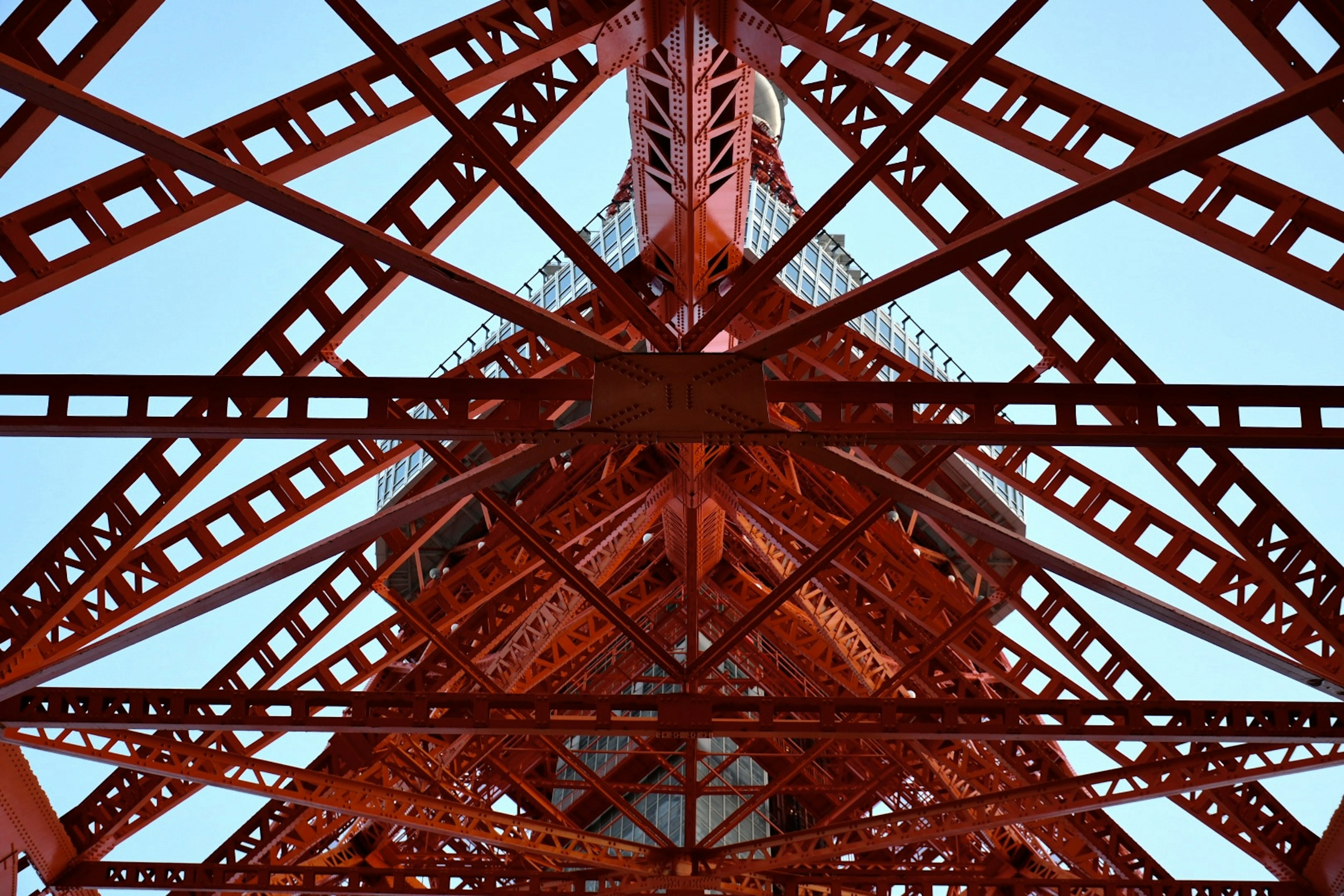 View of the red iron framework of Tokyo Tower from below