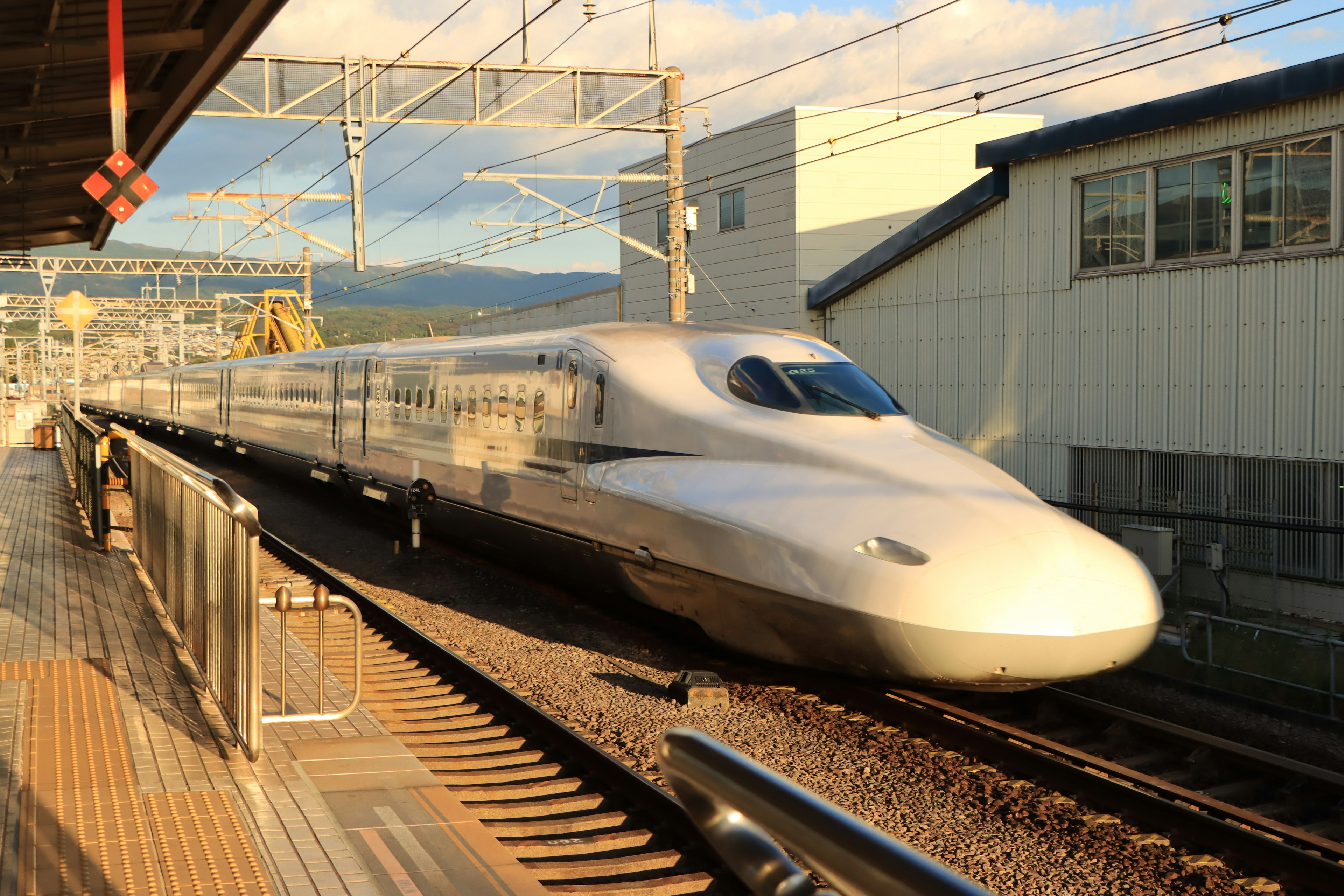 Shinkansen train arriving at a station