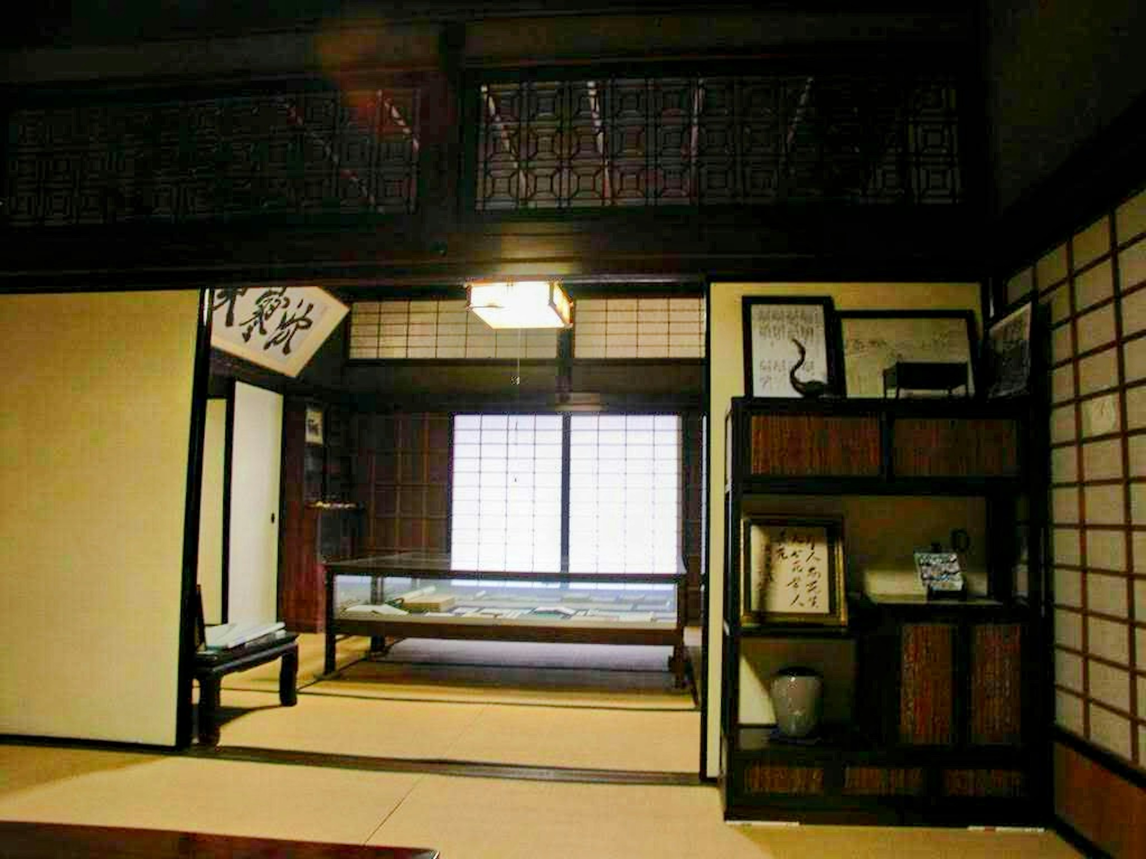 Traditional Japanese room interior with shoji screens, tatami mats, and natural light