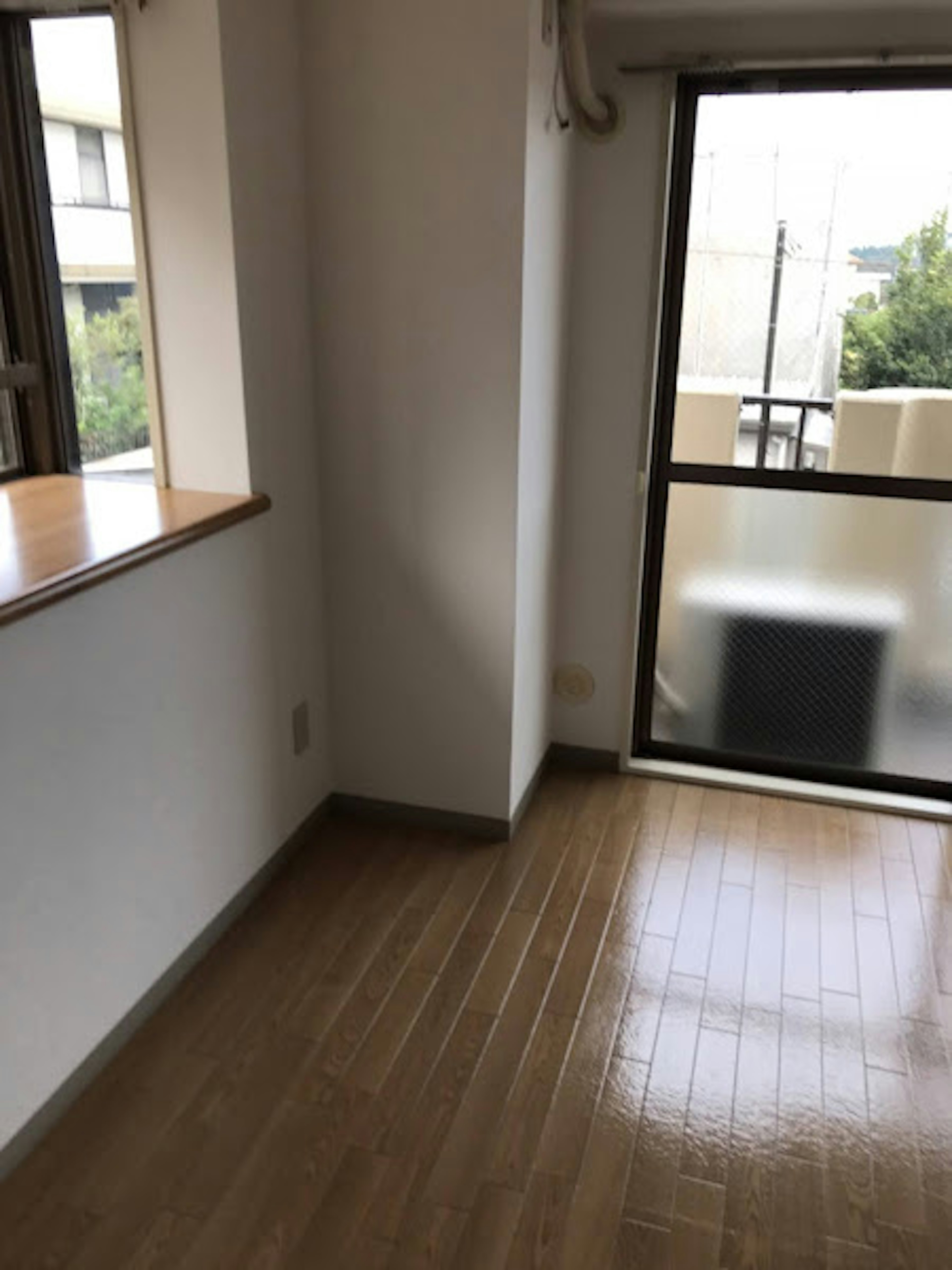 Bright room interior featuring a window and balcony door