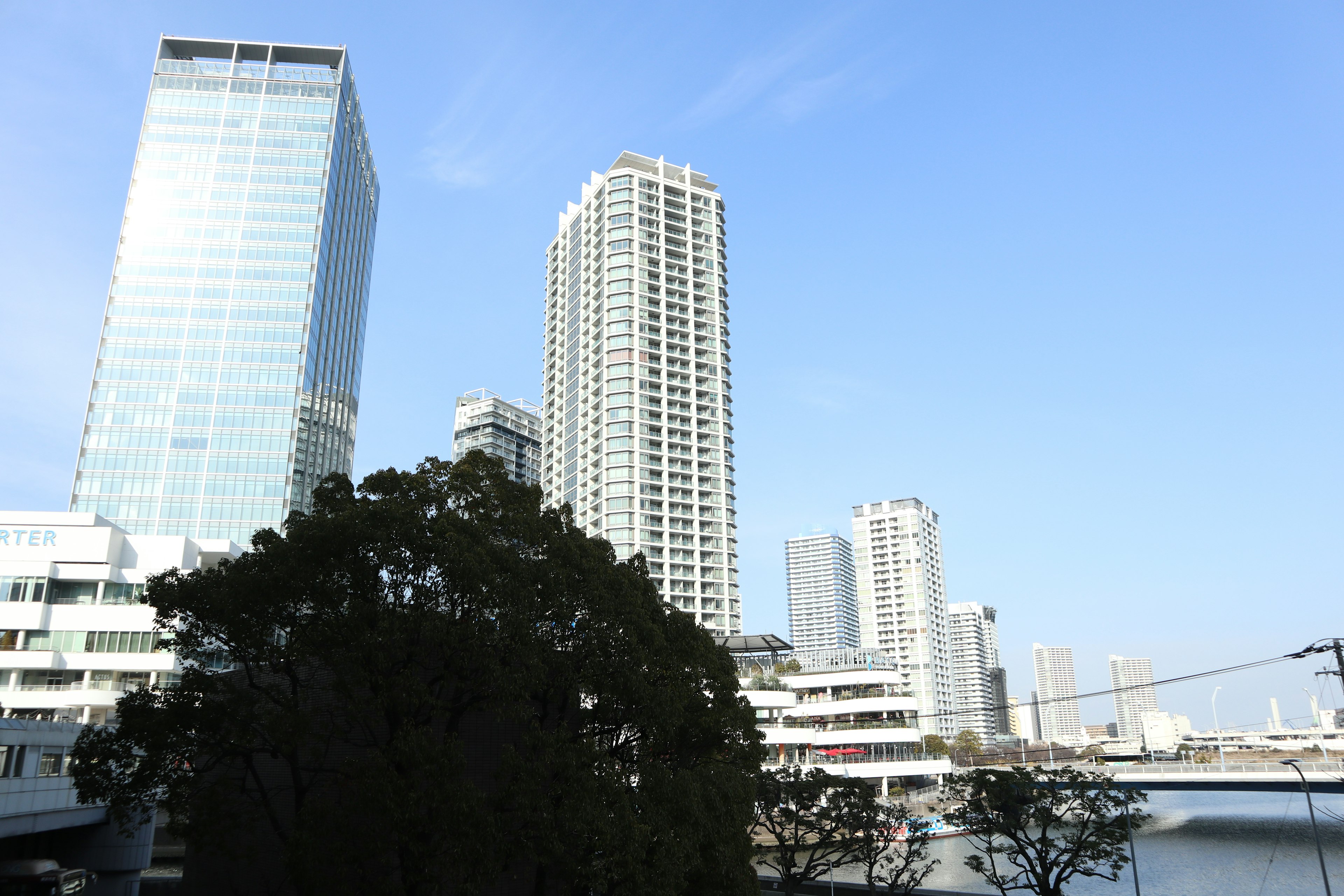 Cityscape featuring tall buildings and clear blue sky