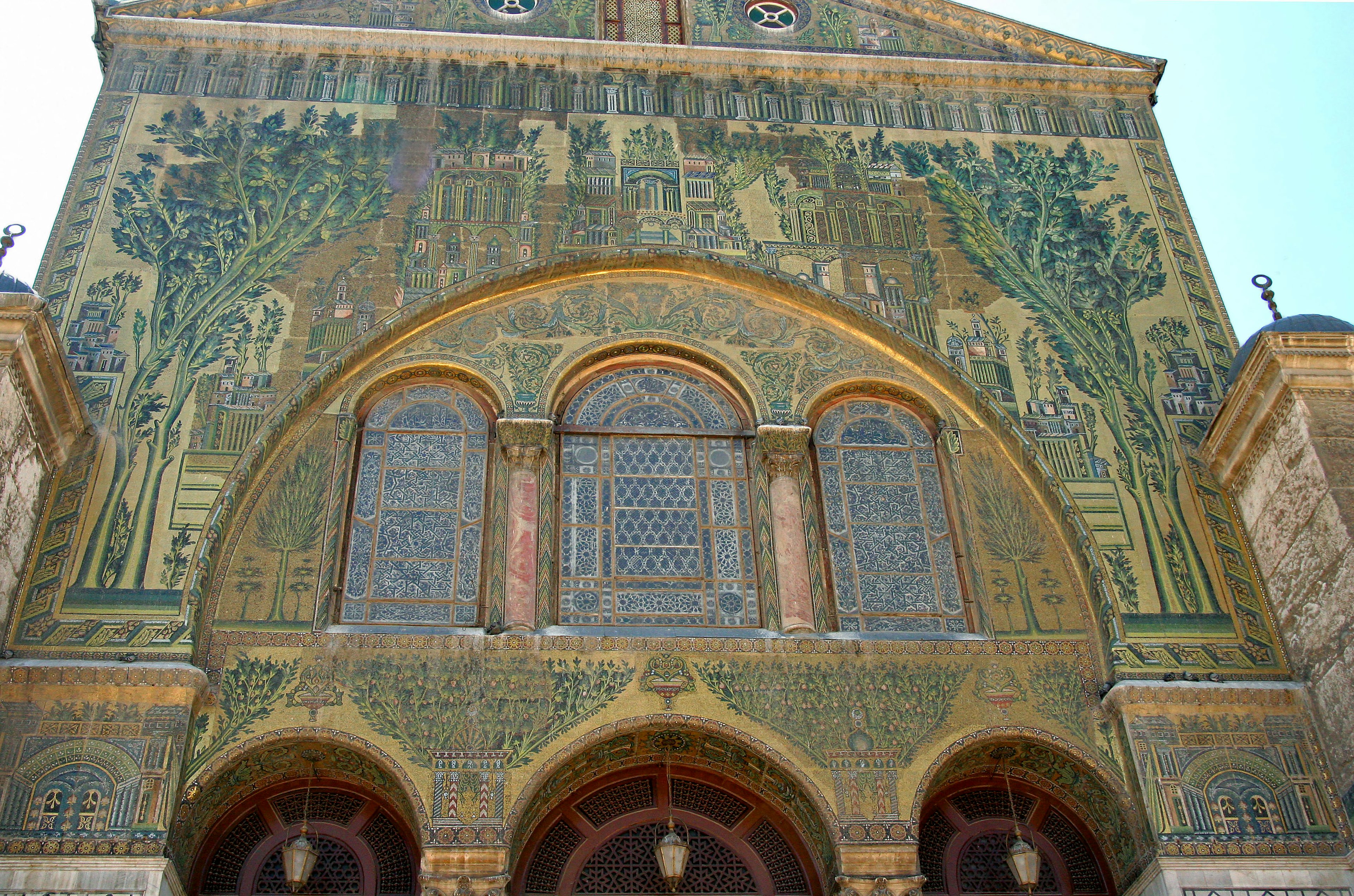 Detailed view of a building facade adorned with intricate mosaics