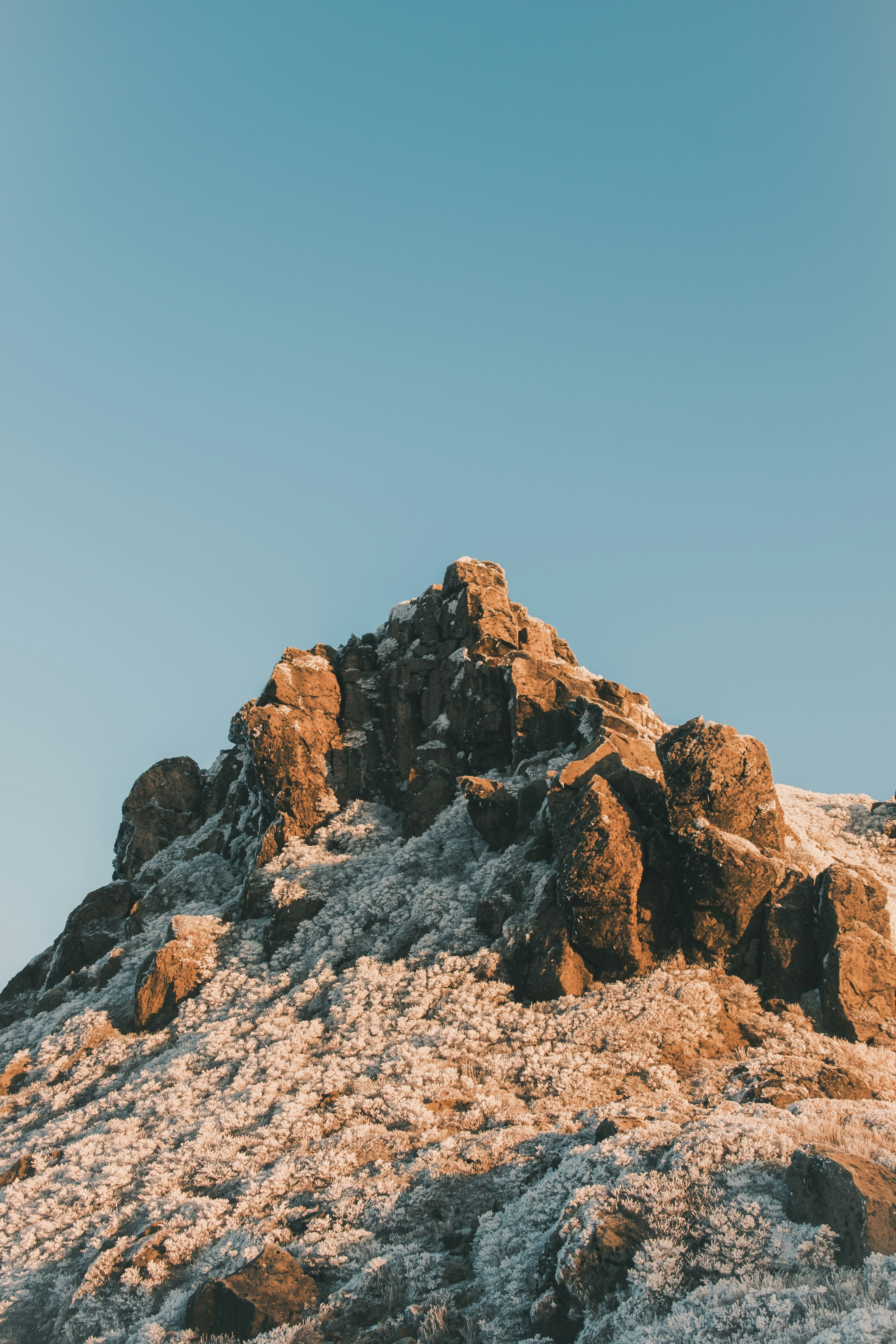 Snow-covered mountain peak against a blue sky