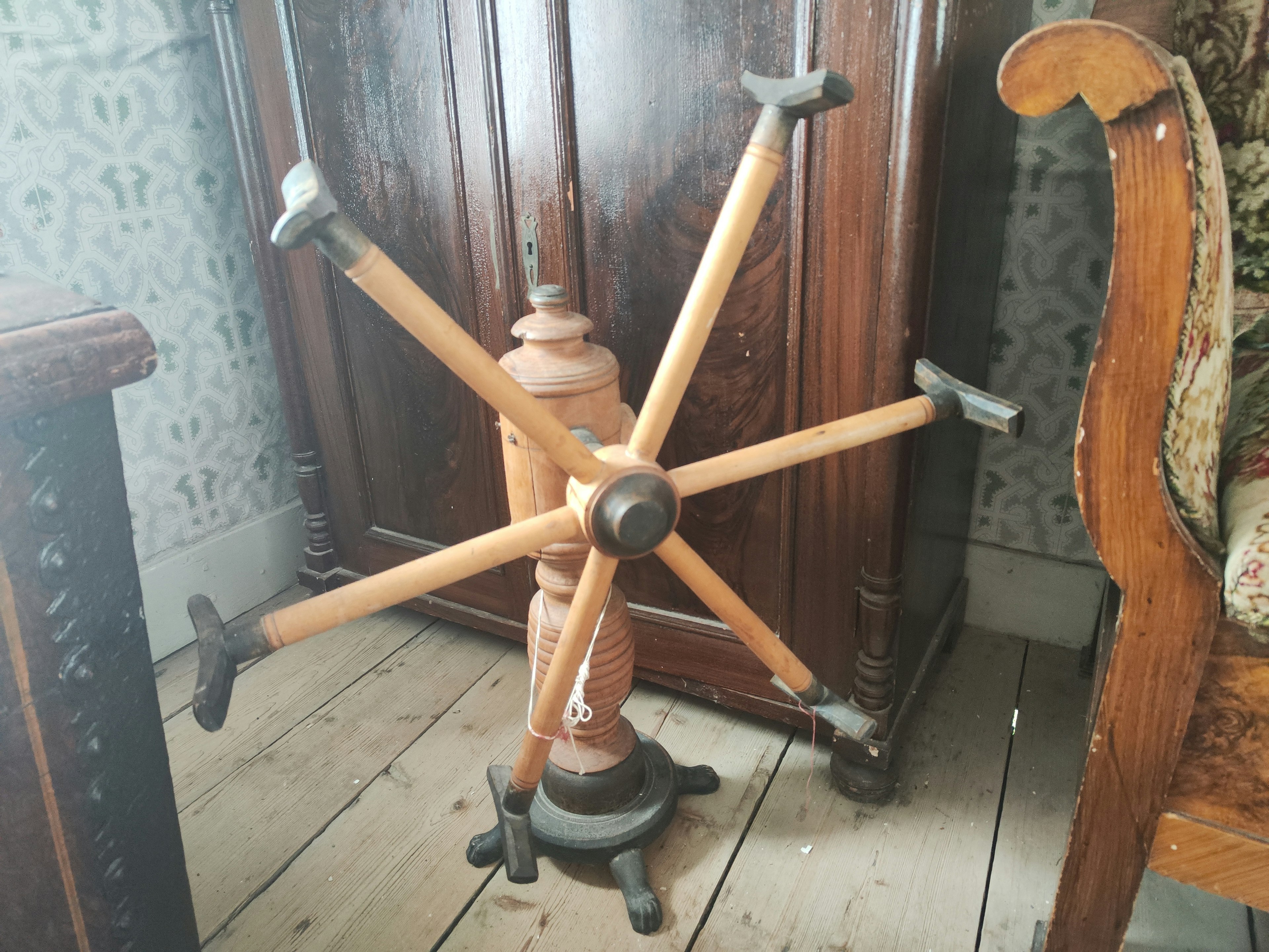 Vintage wooden chair base with metal feet and intricate design