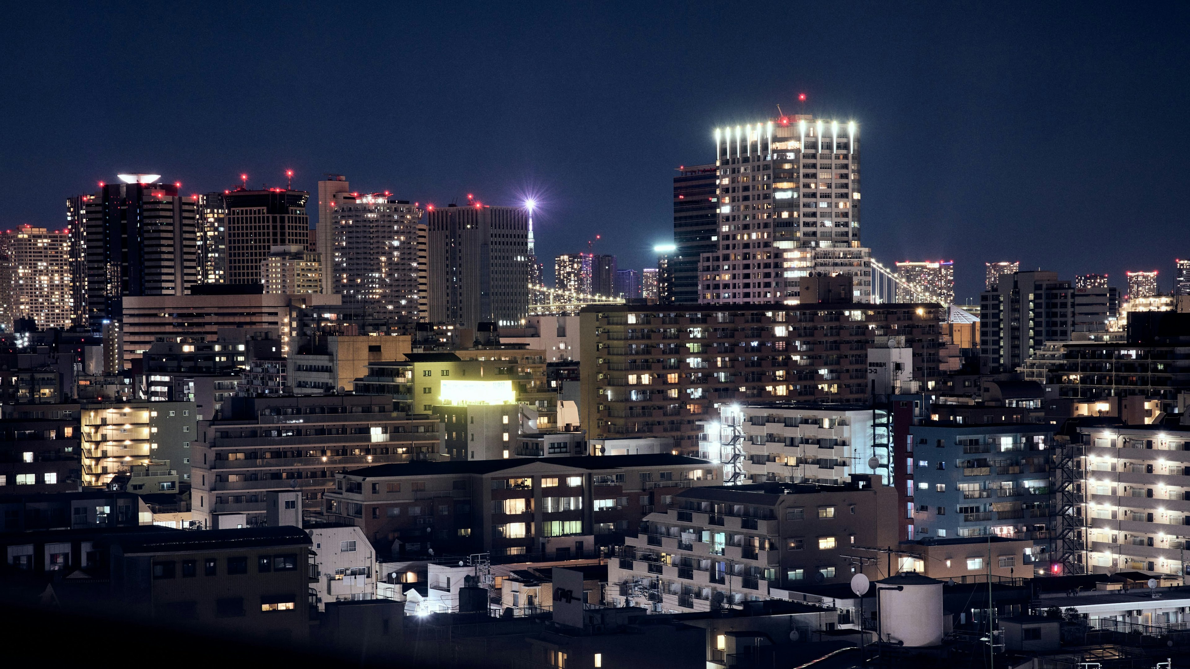 Tokyo skyline at night with illuminated buildings