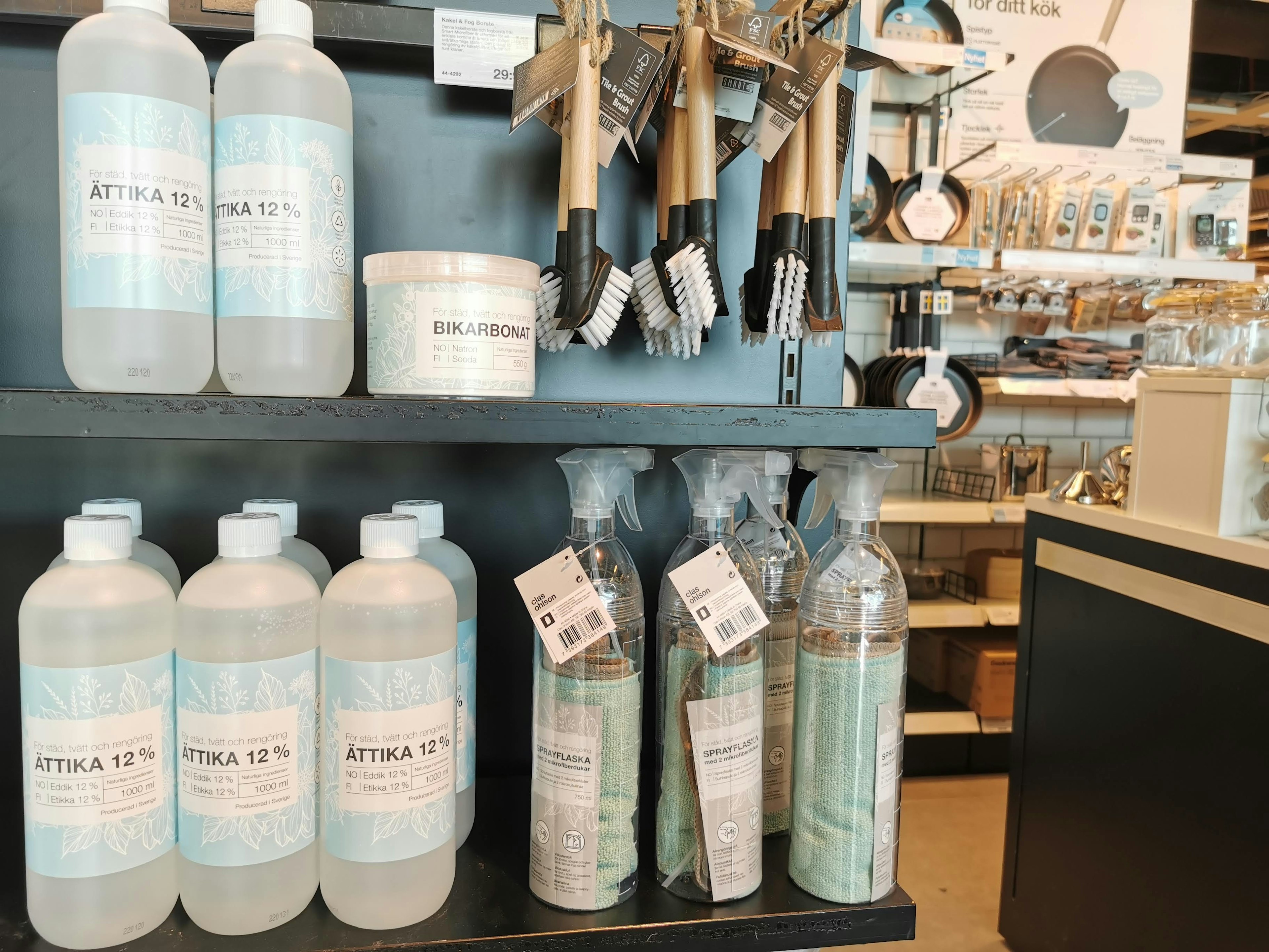 Image featuring neatly arranged bottles and brushes on a shelf