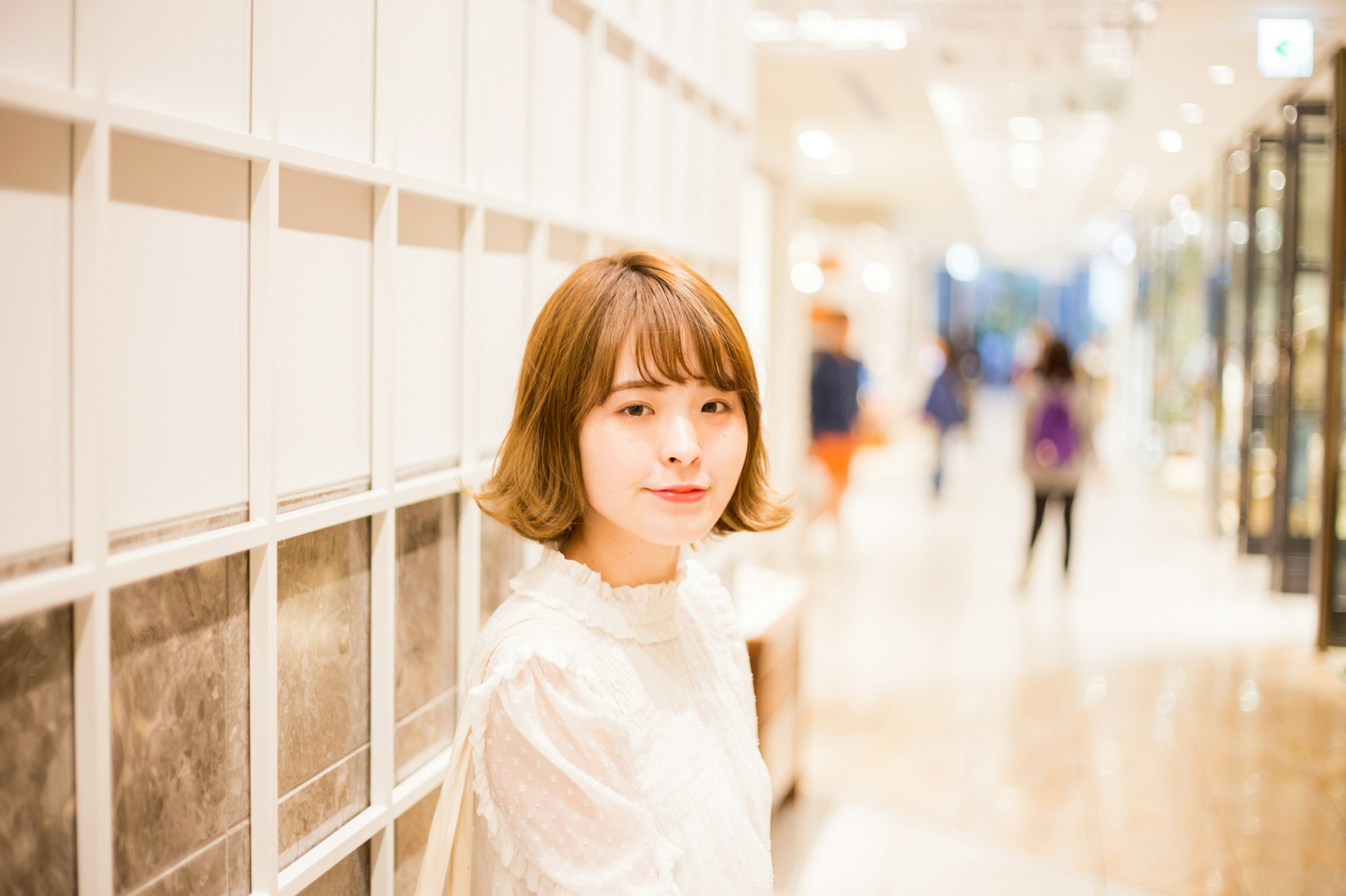 Portrait of a smiling woman in a bright indoor setting