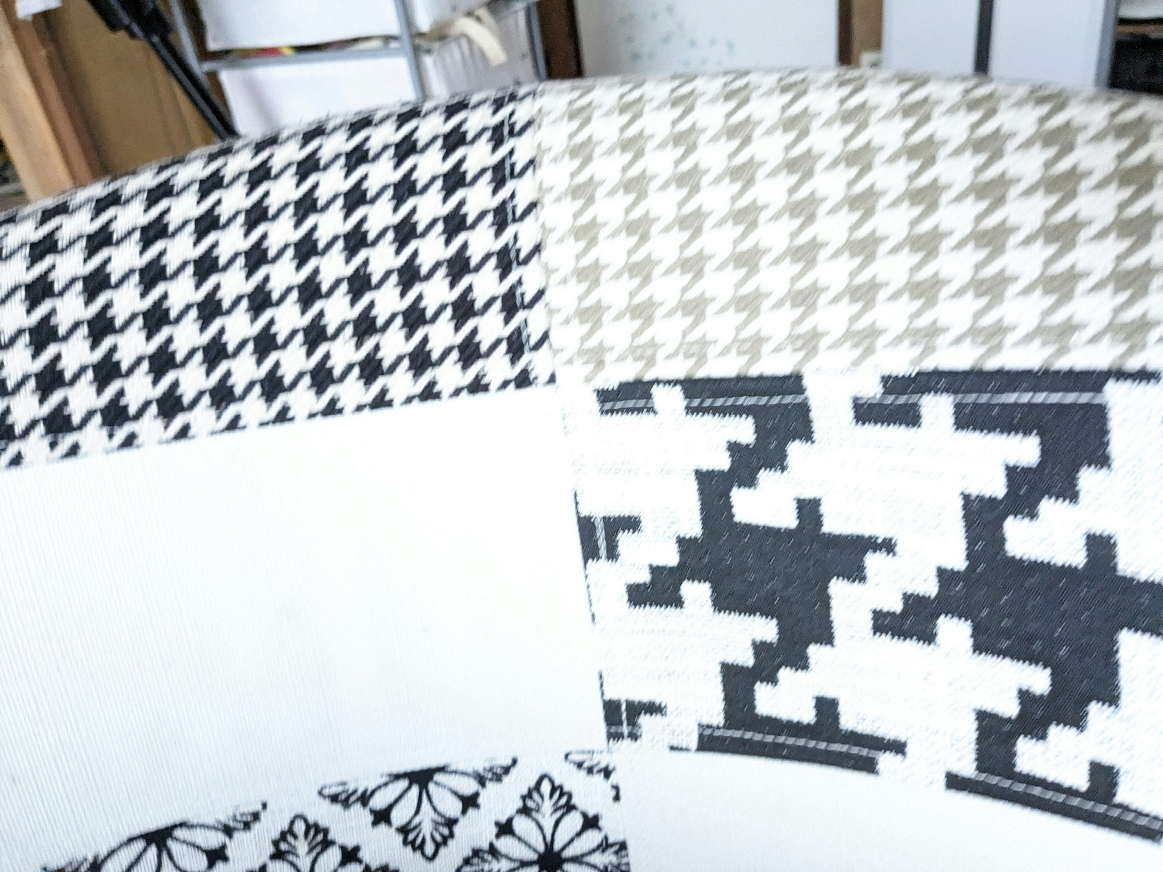 Collection of fabrics featuring black and white houndstooth patterns