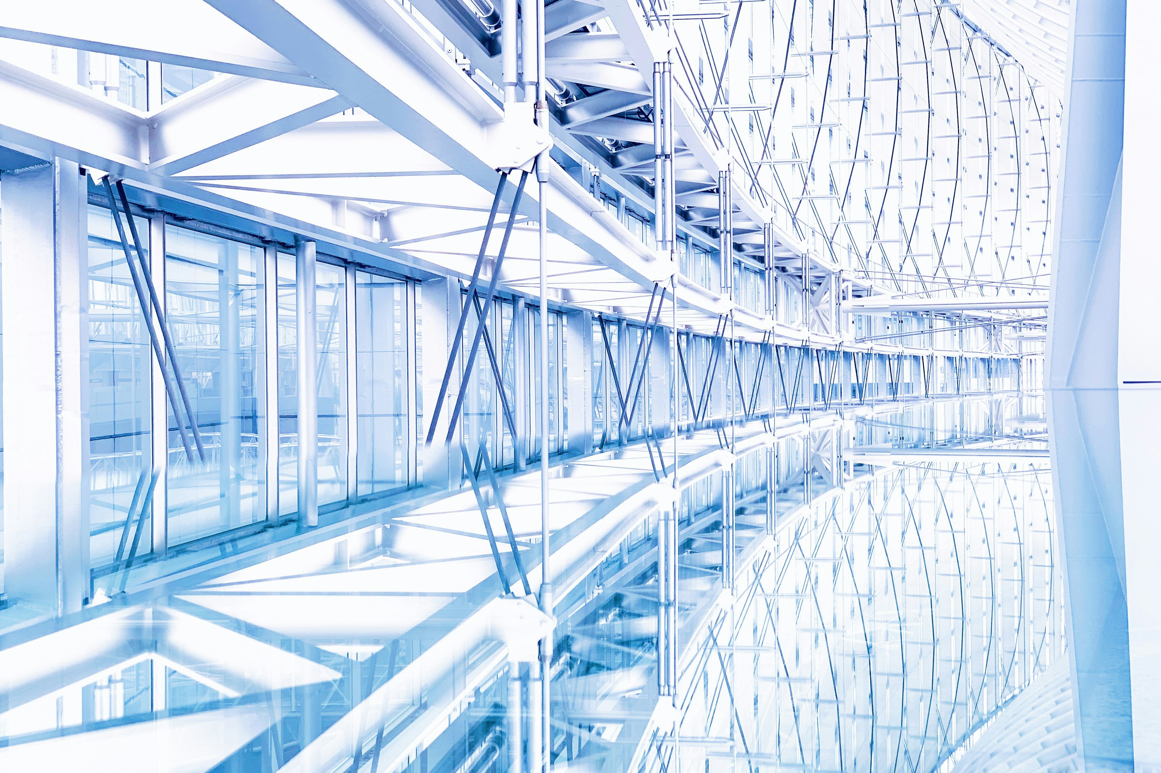 Modern interior of a building with white and blue tones Reflective floor and geometric structures